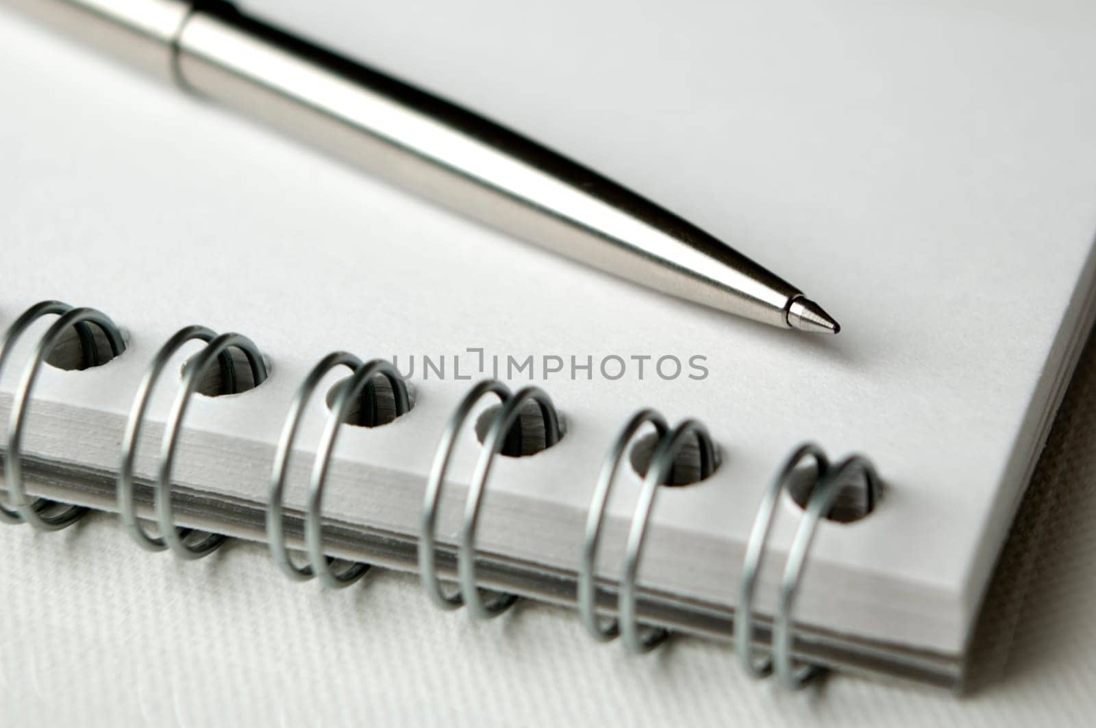 business notepad with pencil close up shoot
