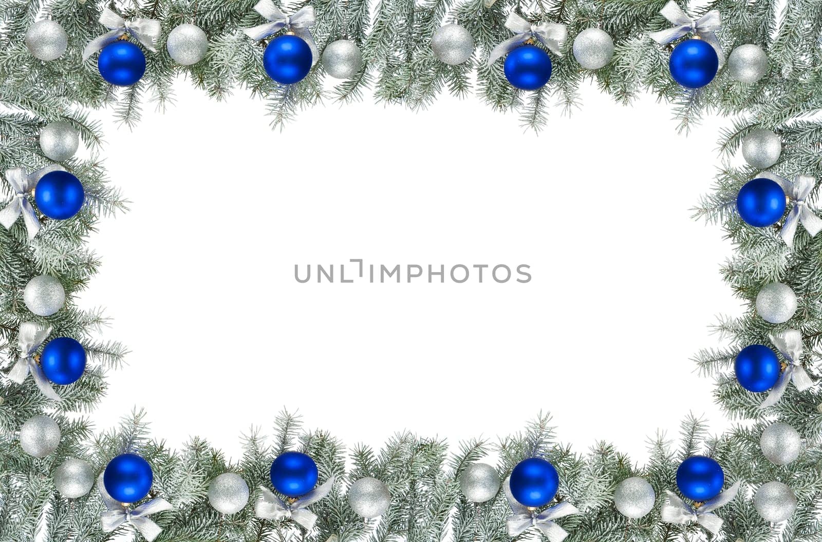 christmas frame made from pine branch and ornaments on white