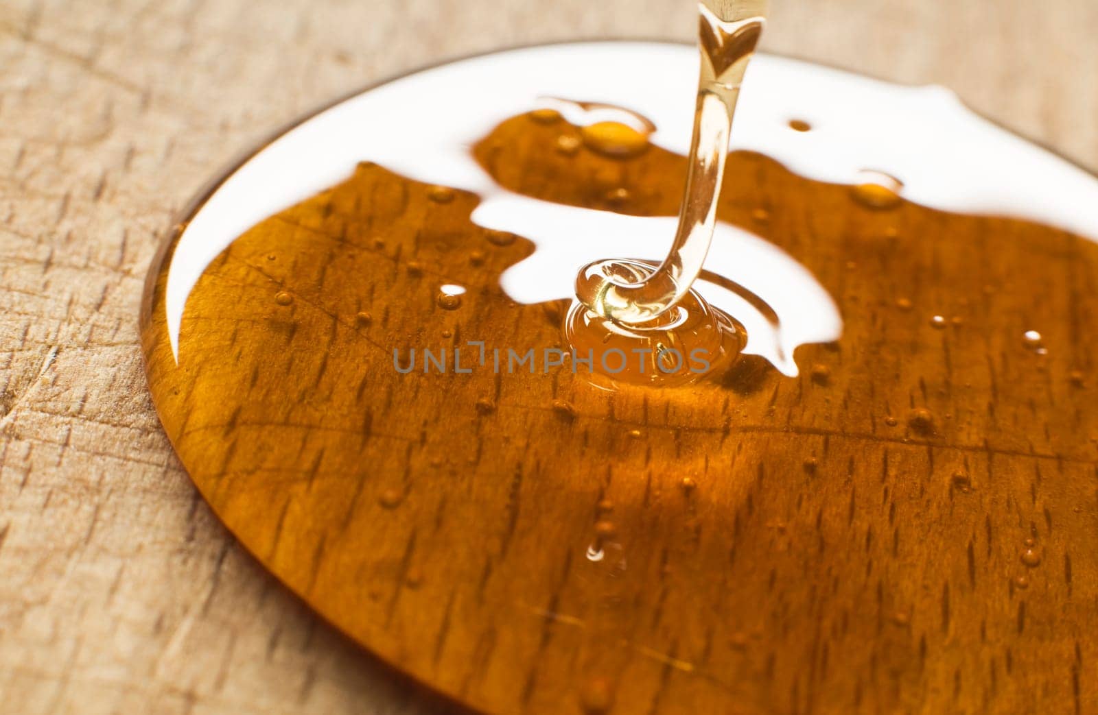wild yellow honey pouring close up shoot