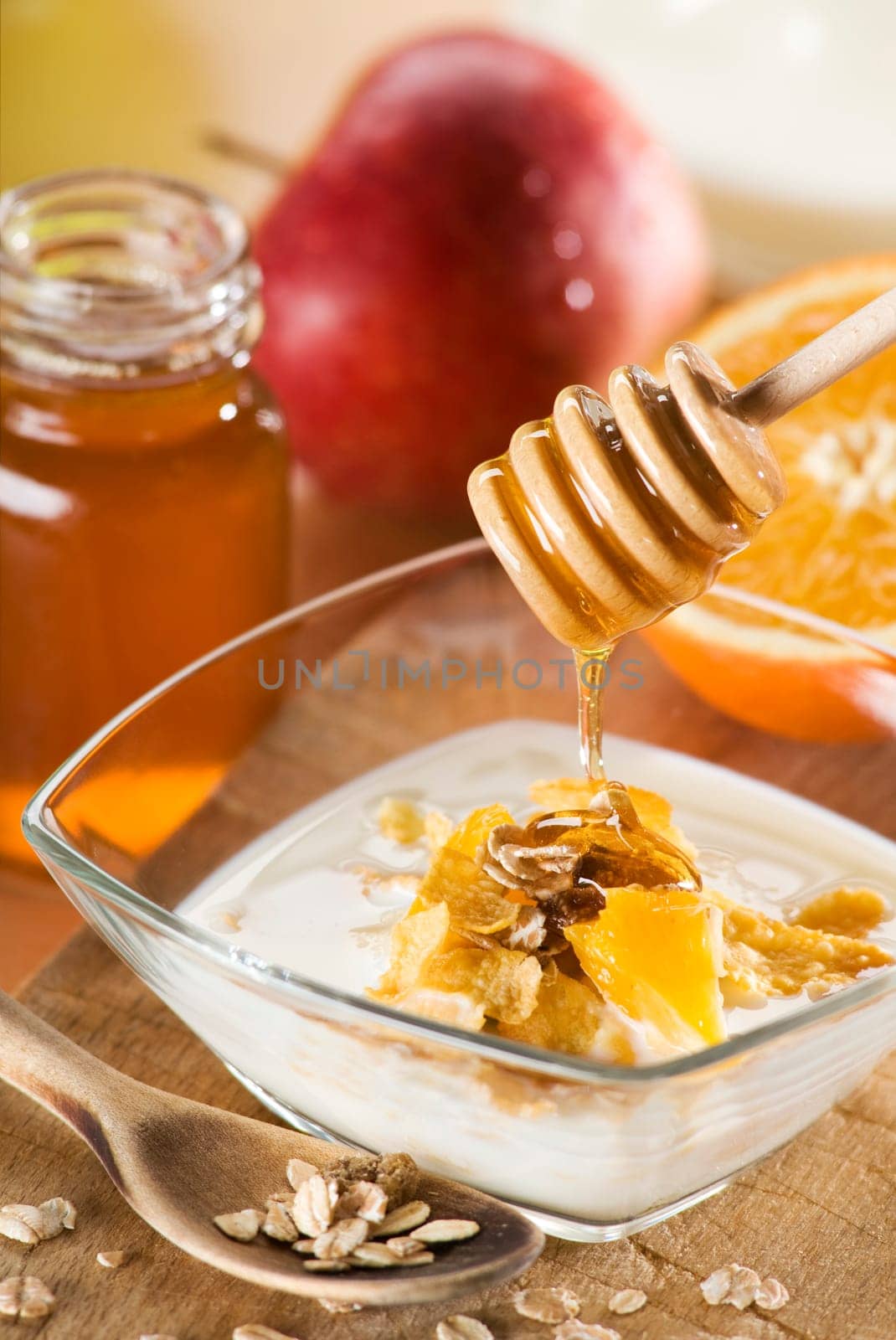 muesli with milk honey and fruit close up