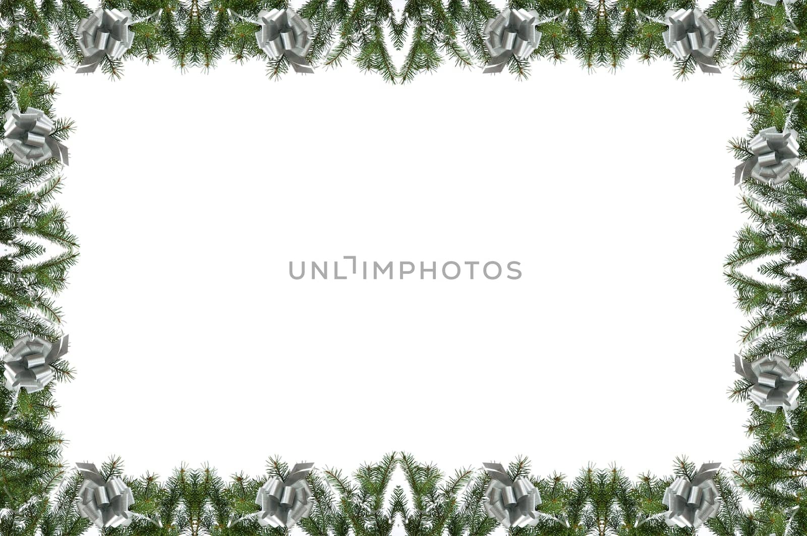 christmas frame made from pine branch and silver bow on white