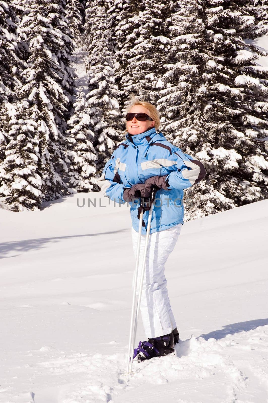 young blond woman on fresh snow close up
