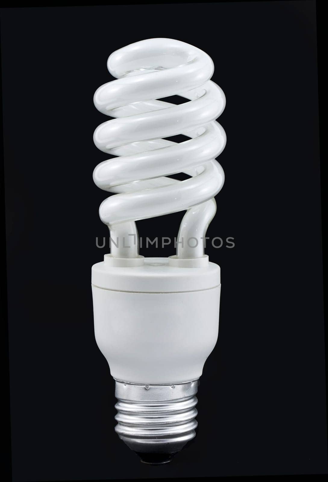 23W compact fluorescent bulb isolated on a black background