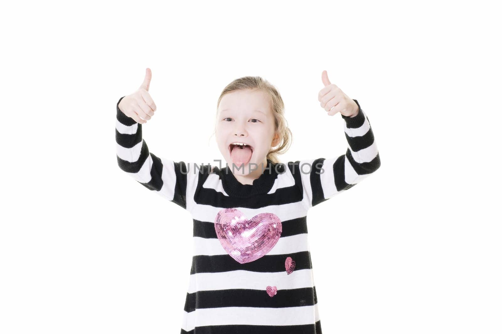 young girl giving a thumbs up sign