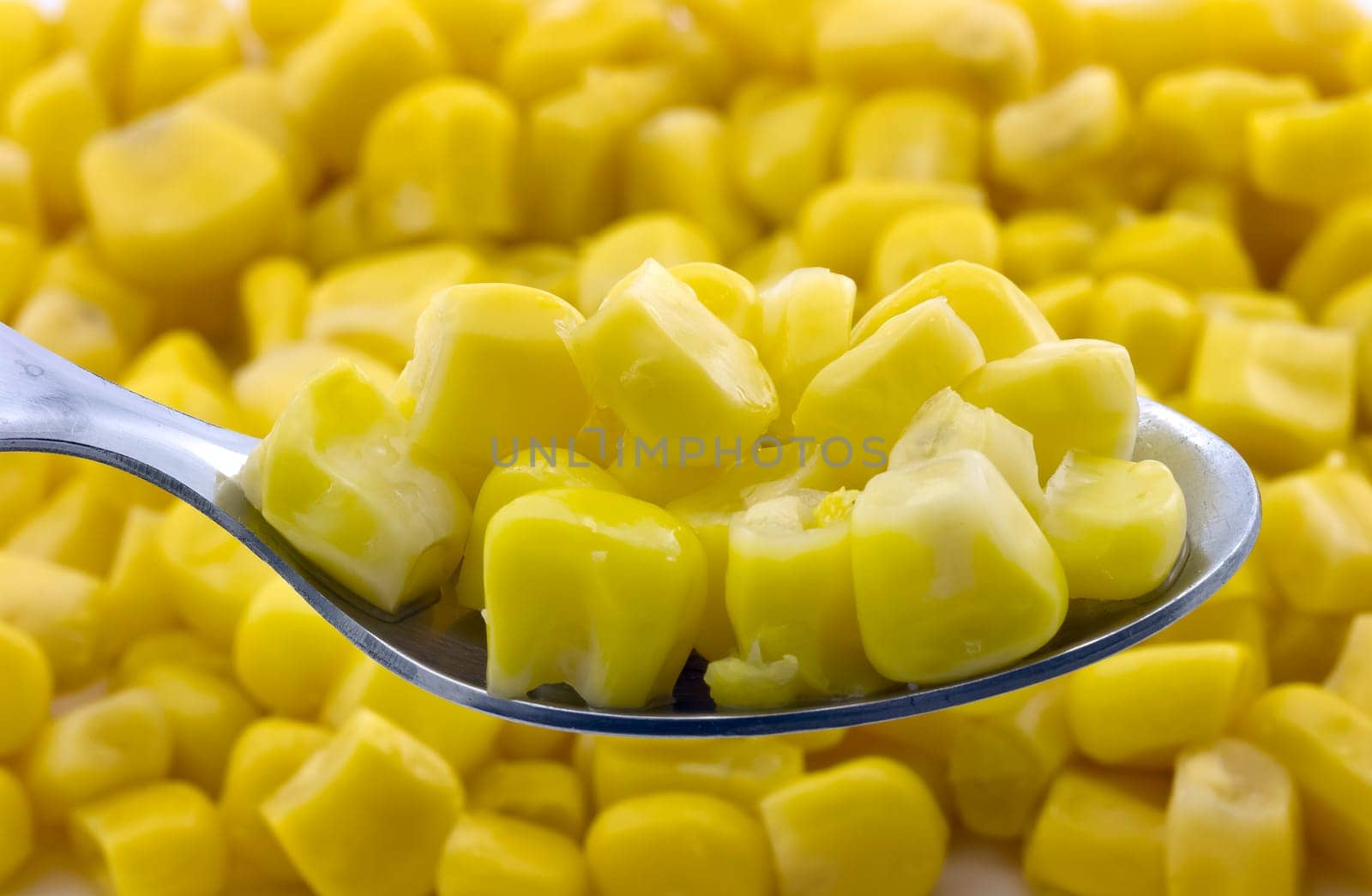 steamed corn seeds, a tablespoon of beans background