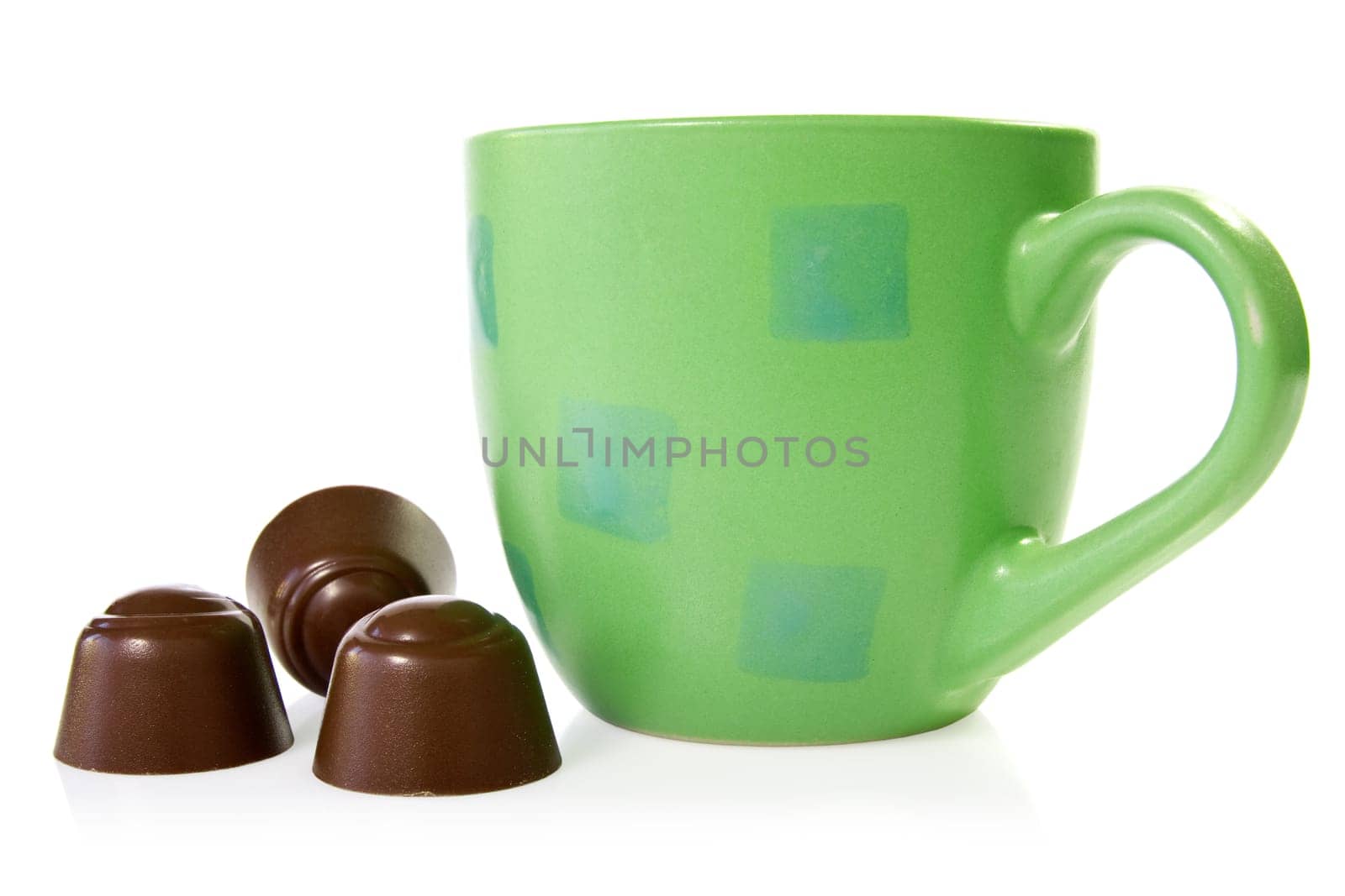coffee cup with chocolate pralines. isolated on white background
