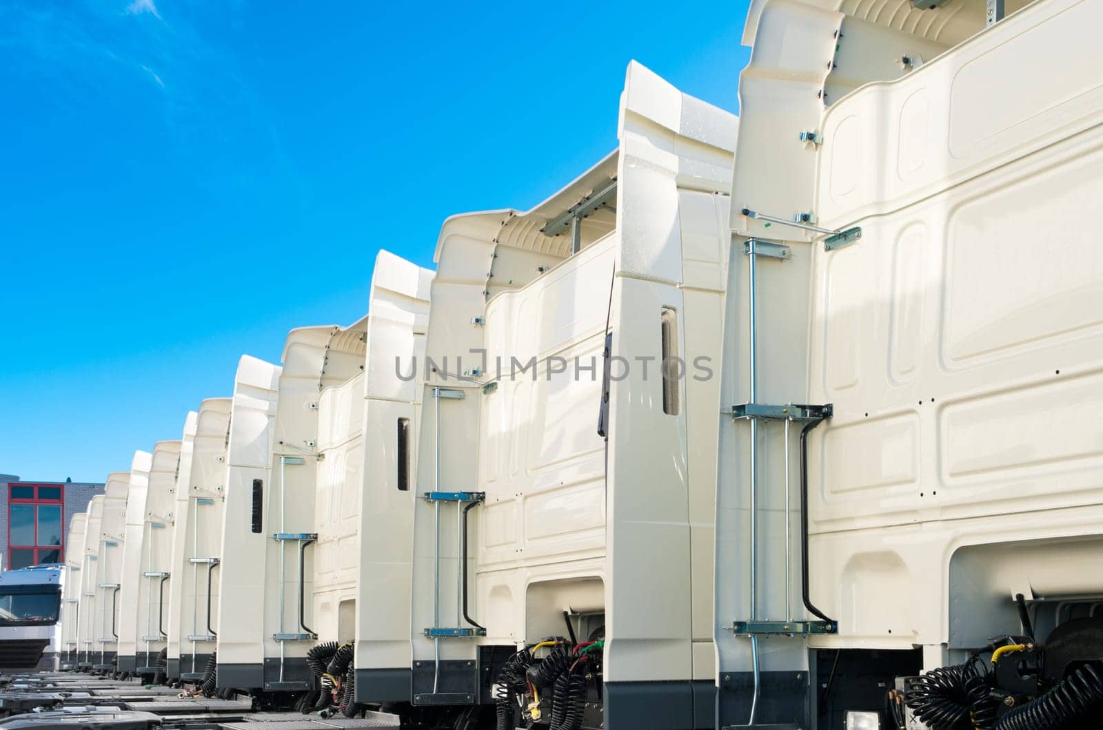 white trucks for rental on an industrial area