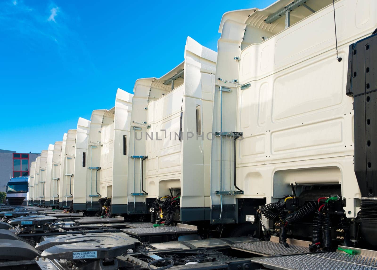 white trucks for rental on an industrial area