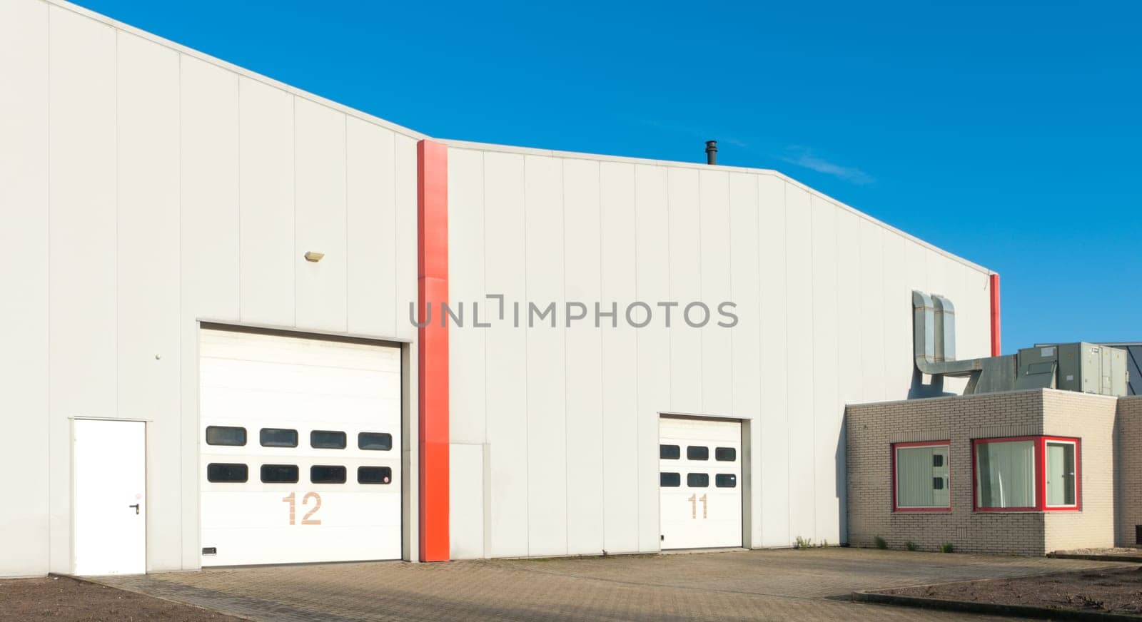 numbered industrial roller doors in a large warehouse