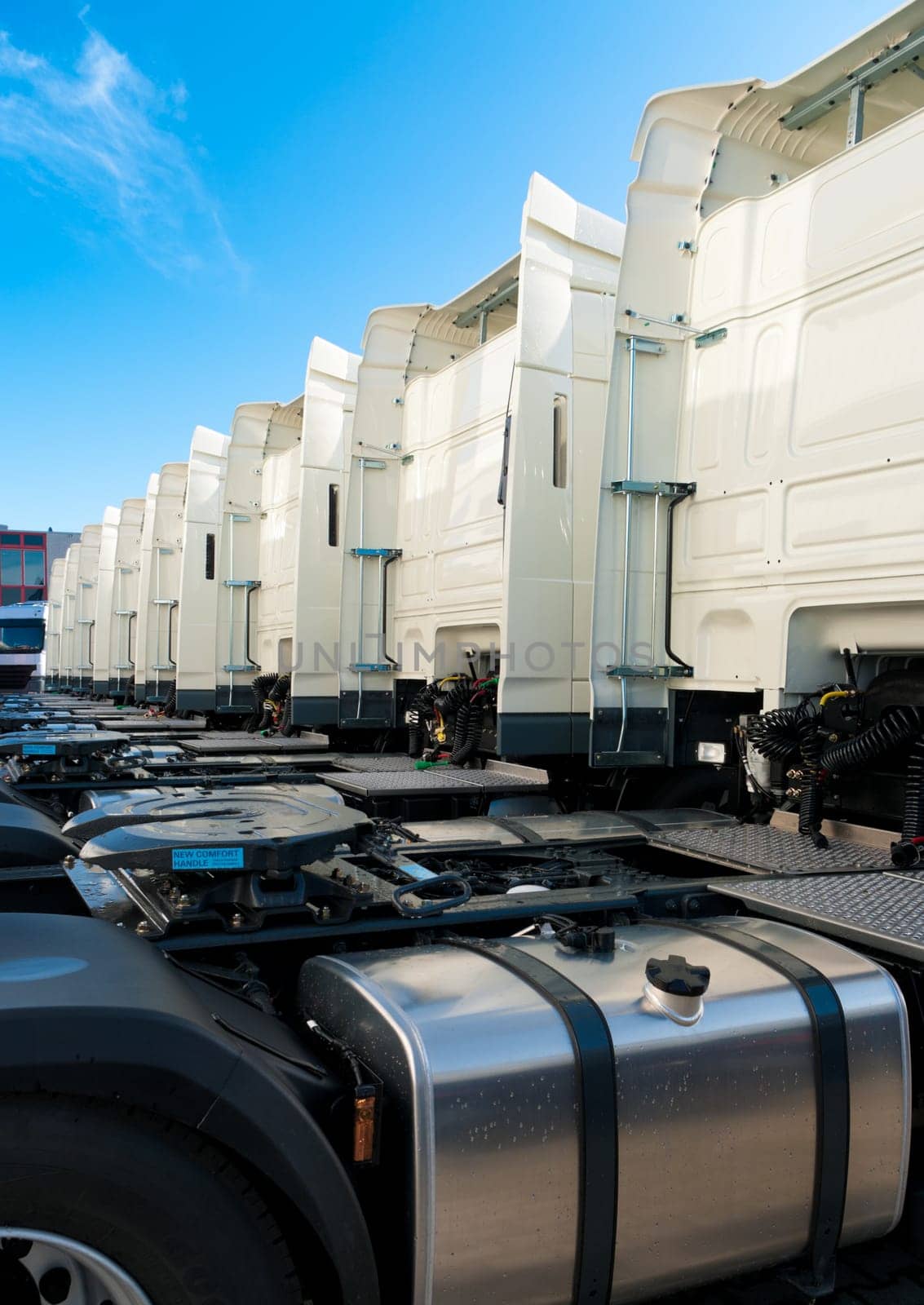 white trucks for rental on an industrial area