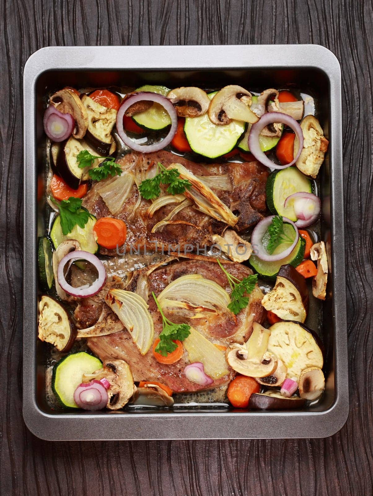 Tasty roasted pork meat with mushrooms and vegetable