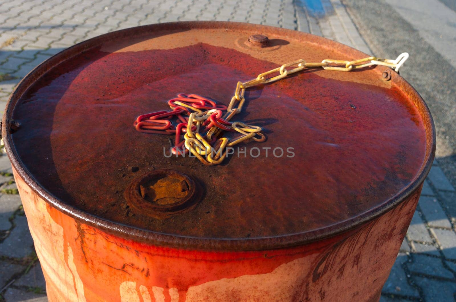 detail of an abandoned rusty oil barrel