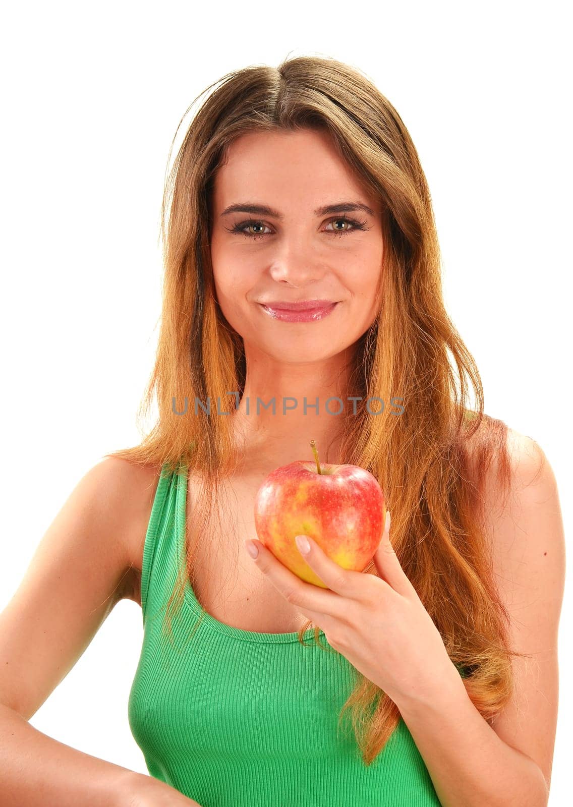 Young beautiful woman holding a red ripe apple in her hand