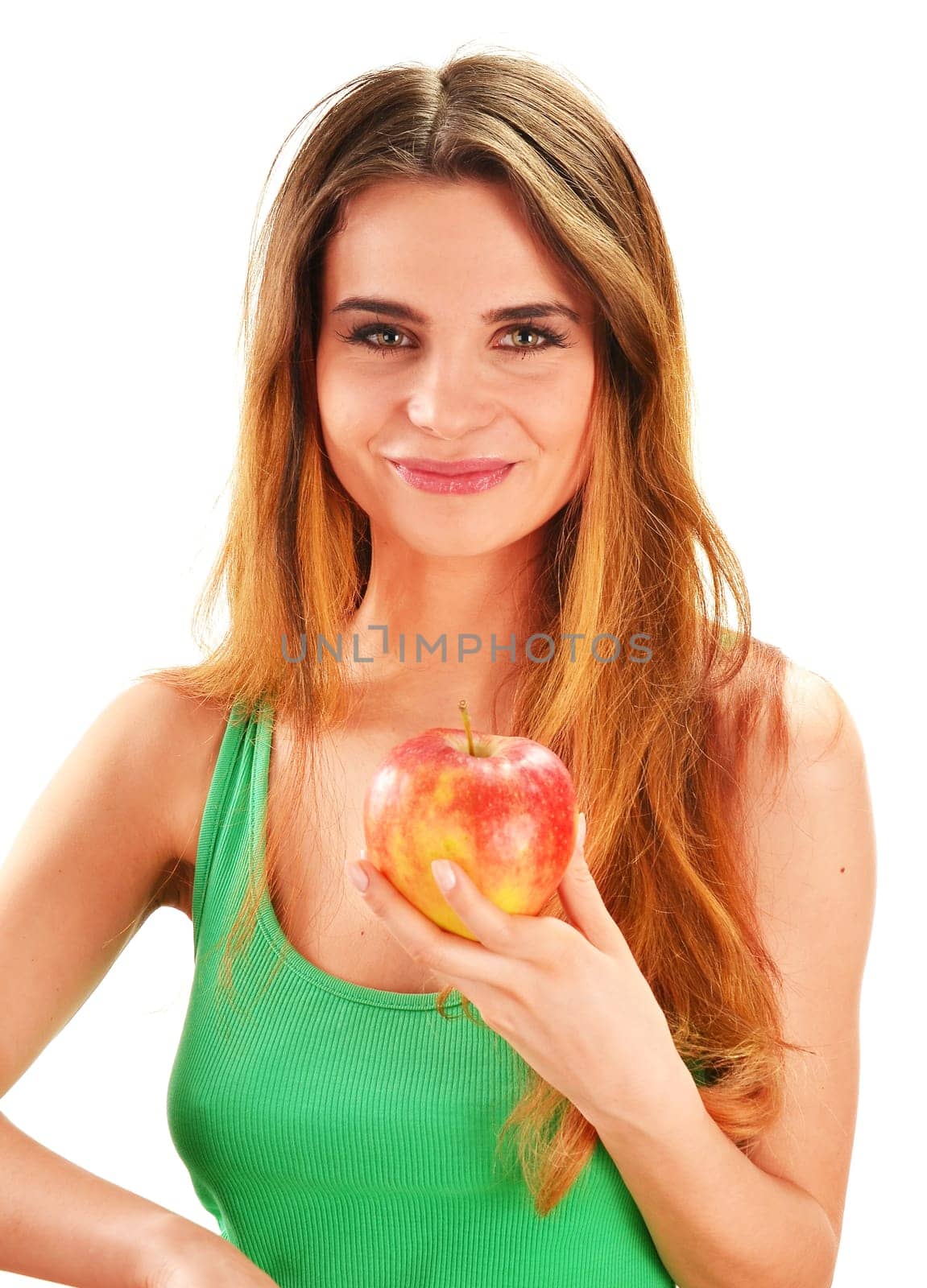 Young beautiful woman holding a red ripe apple in her hand