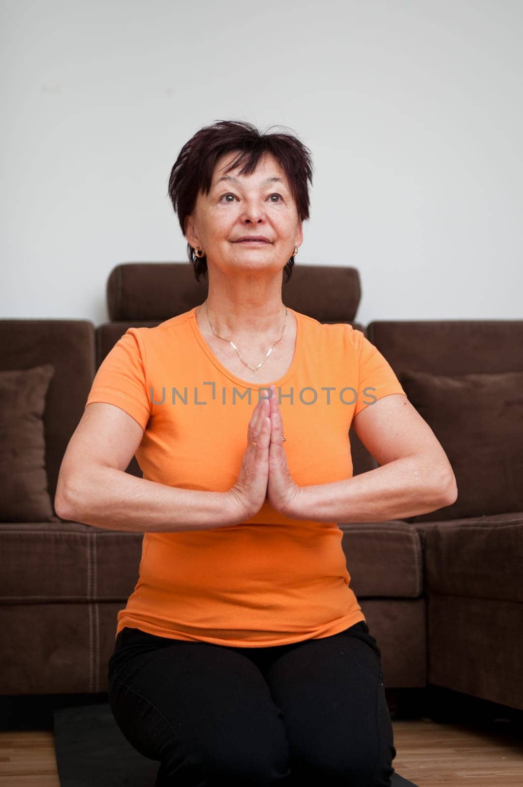 Meditation - senior woman at home