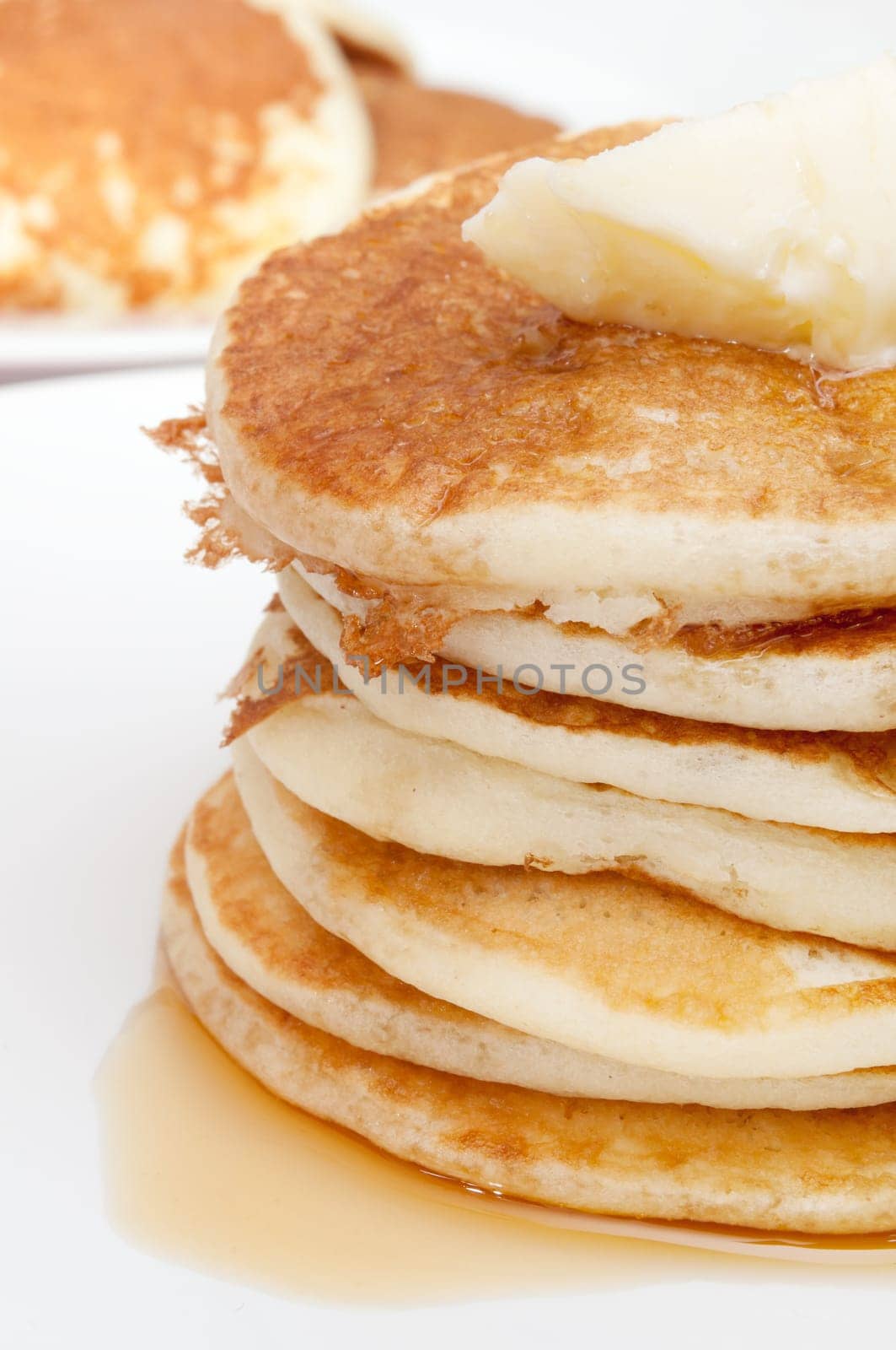 Homemade Pancakes With Butter and Warm Maple Syrup