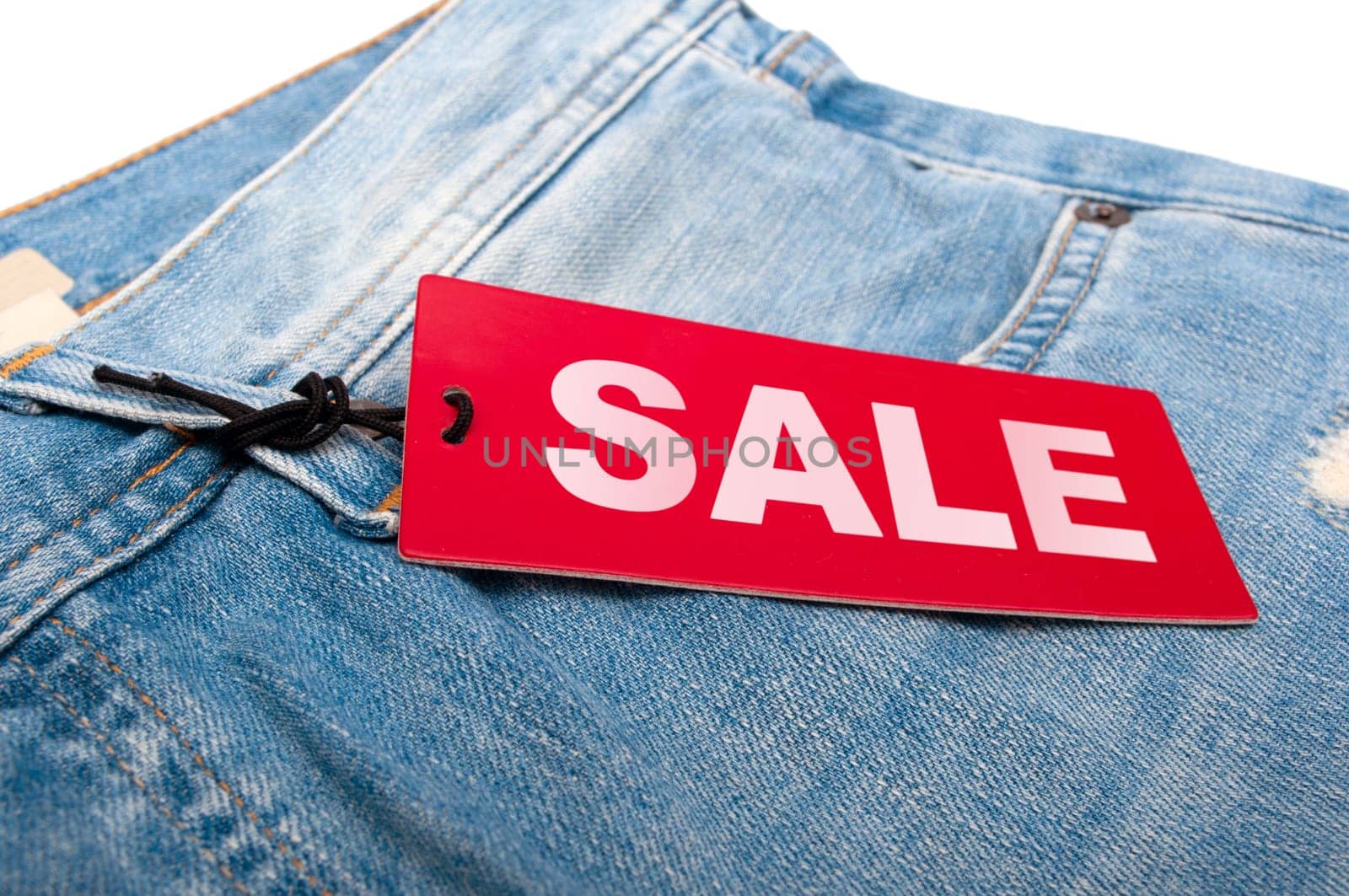 Closeup of Blue Jeans With Red Sale Tag