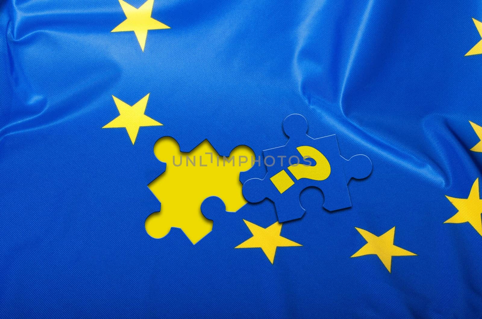 Euroscepticism - Detail of Silky Flag of Blue European Union EU Flag Drapery With Puzzle Piece With Question Mark
