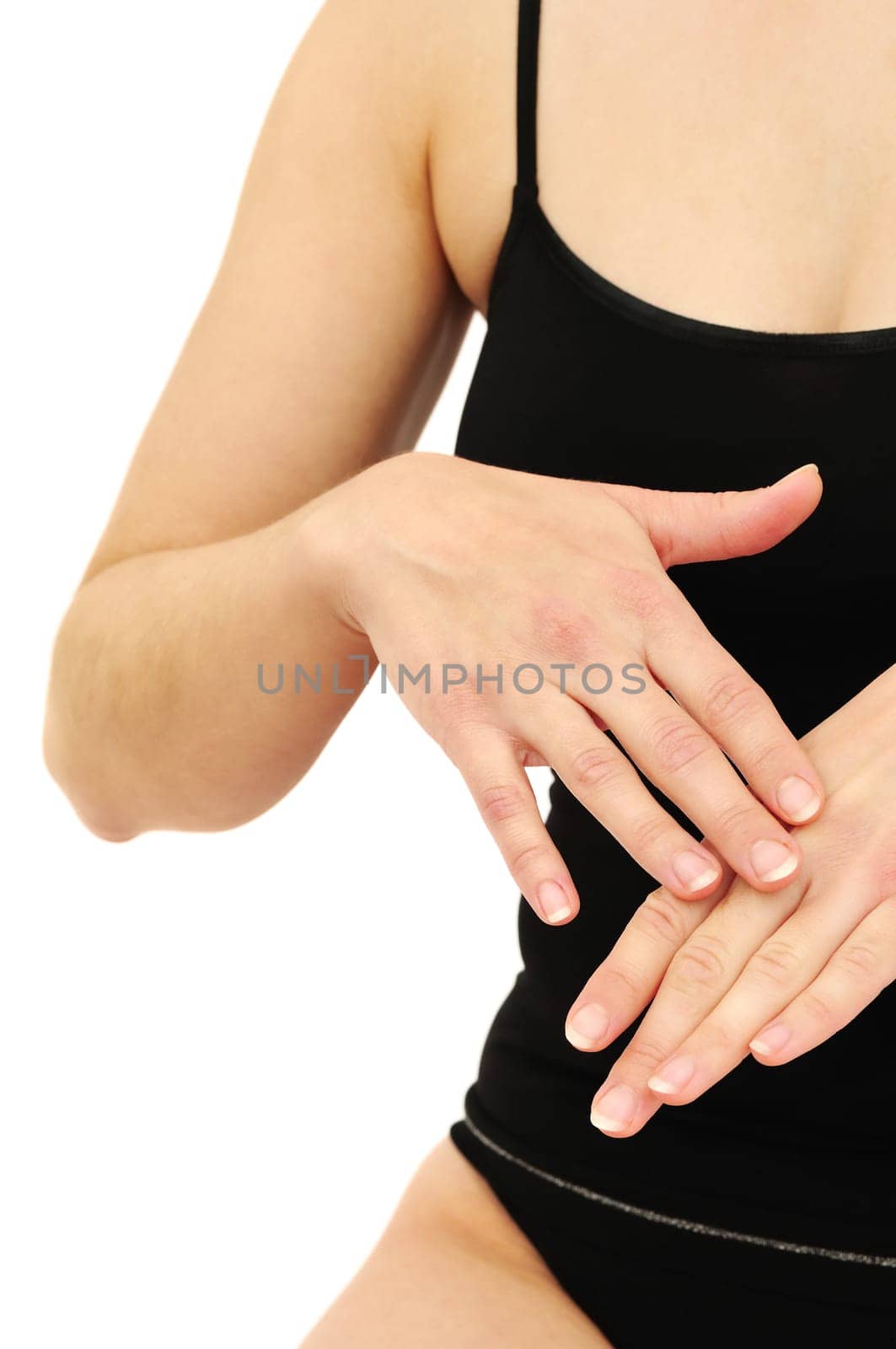 Woman in underwear applies cream on dry hands