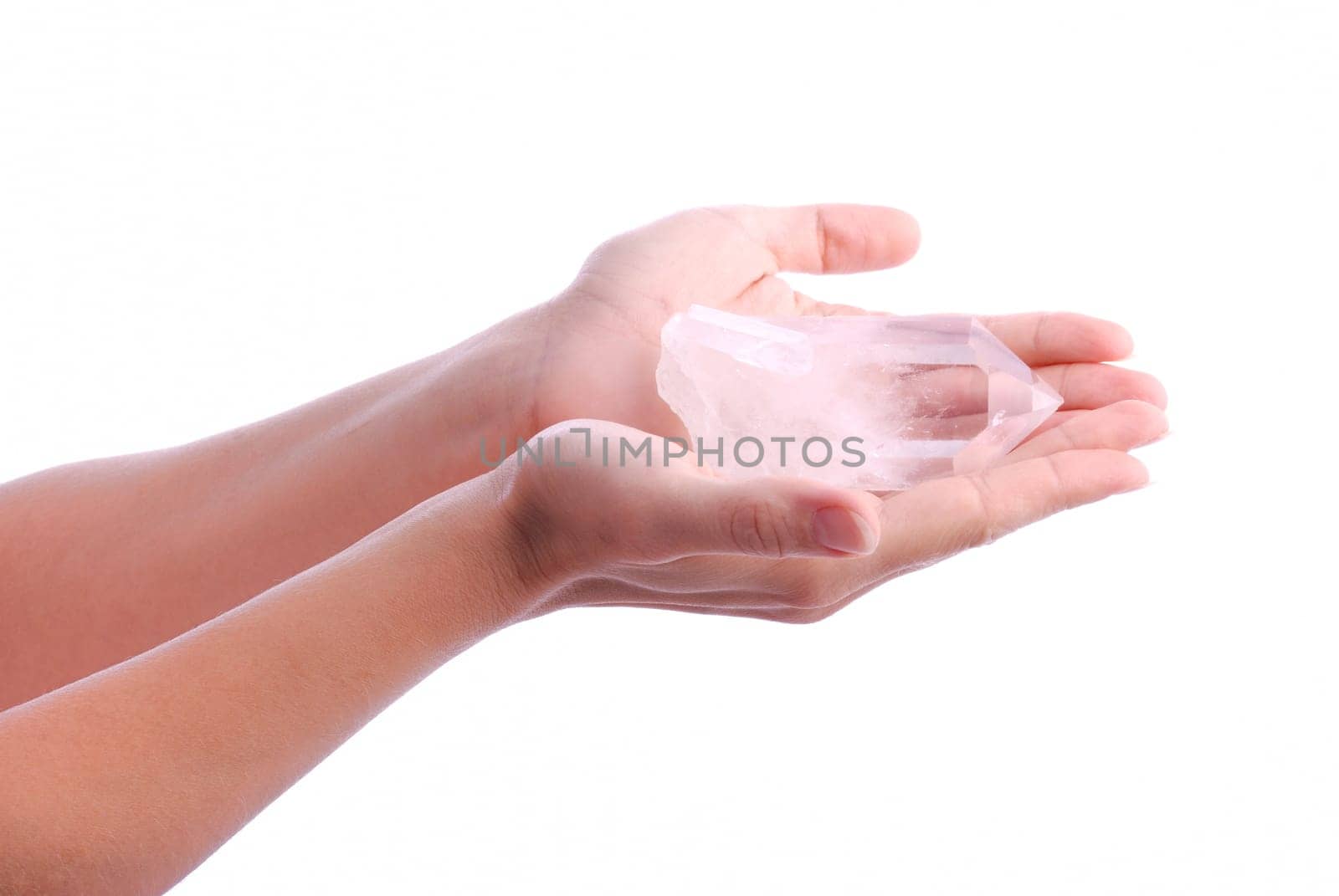 Quartz on hands - semiprecious gems are  used in esoteric and alternative medicine