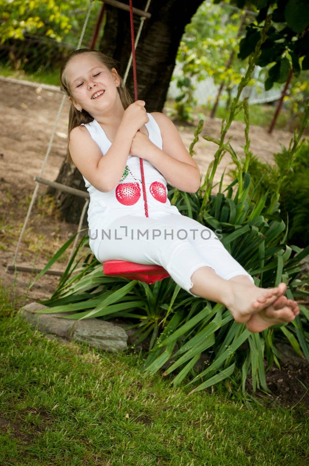 Child swinging on seesaw