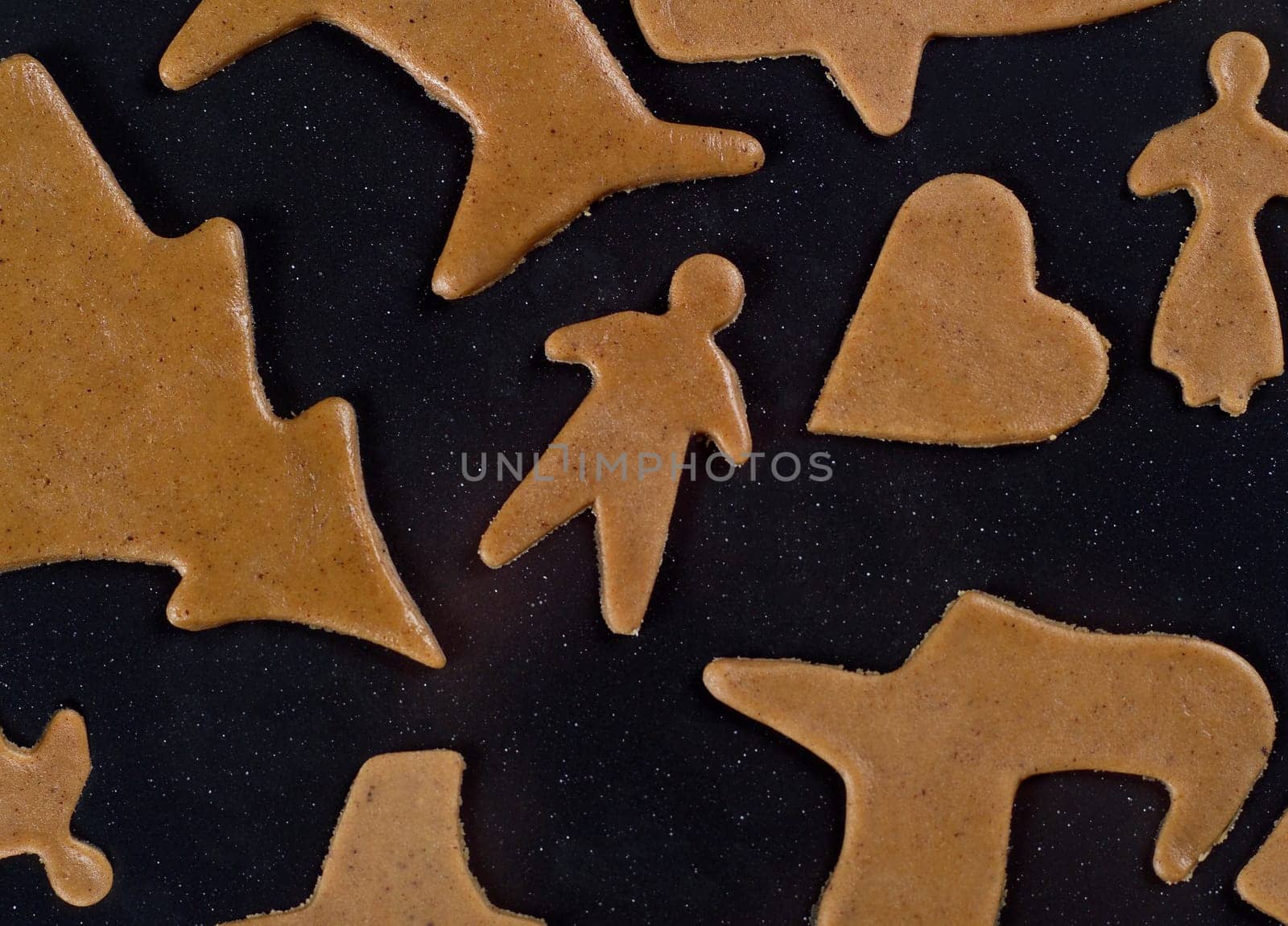 Unbaked Gingerbraed on black background
