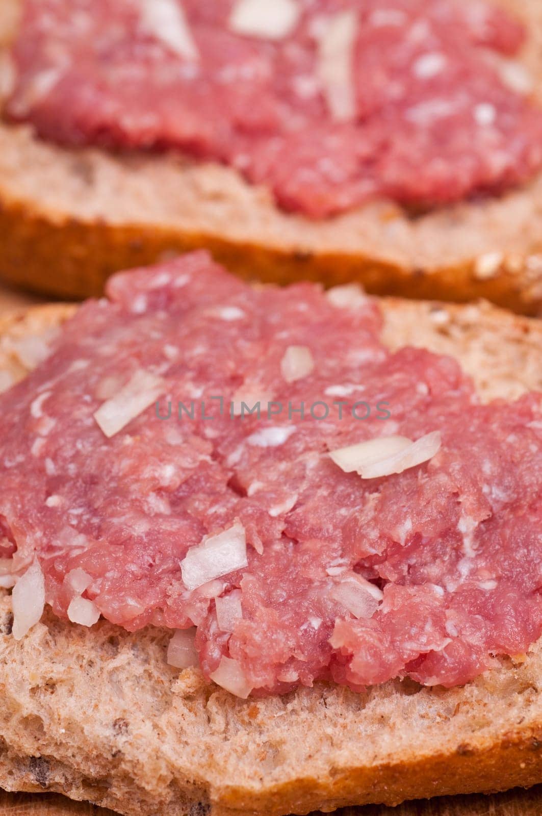 Close-up of a bun with onion minced meat