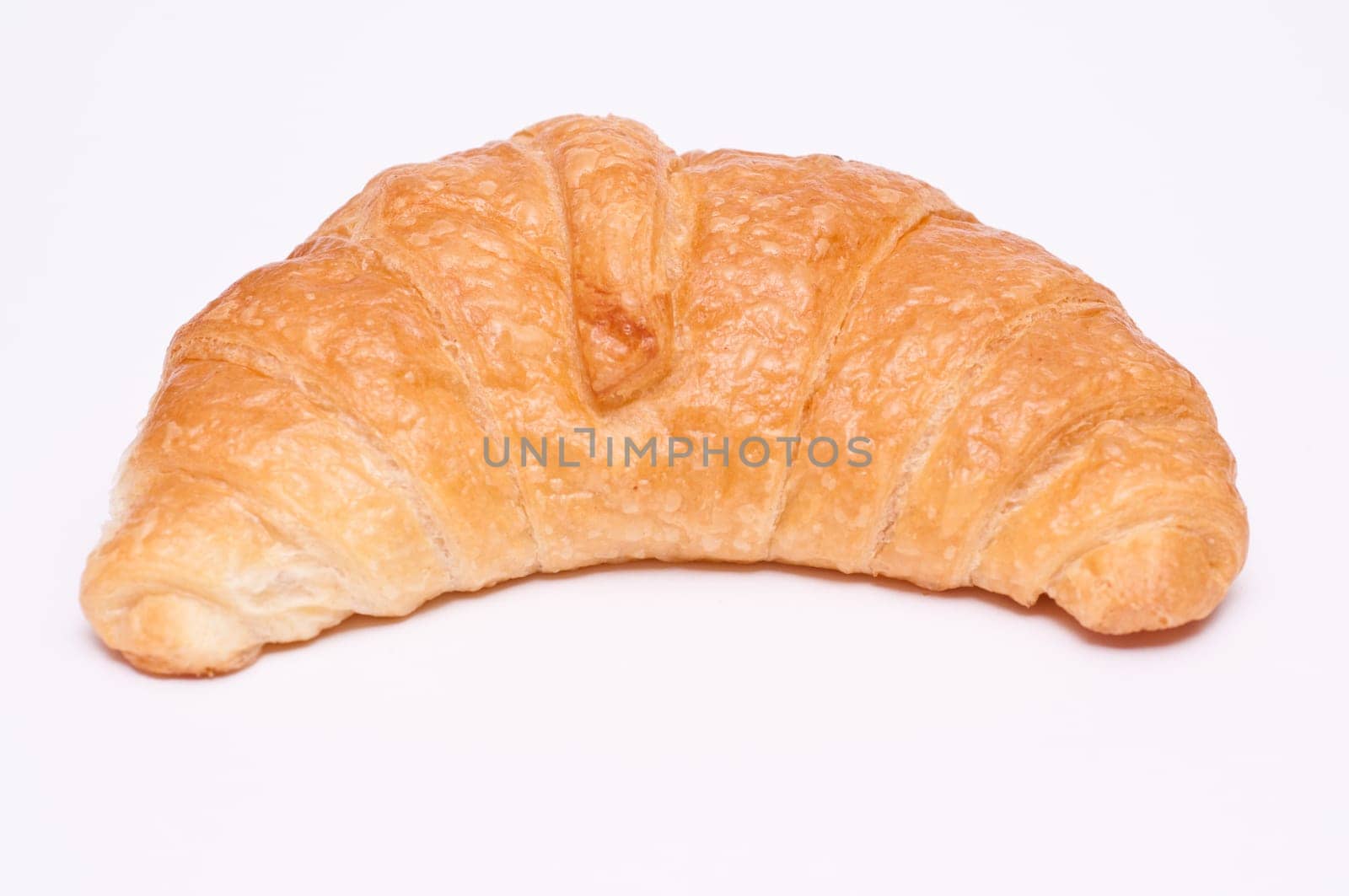 Close-up of a croissant against a white background
