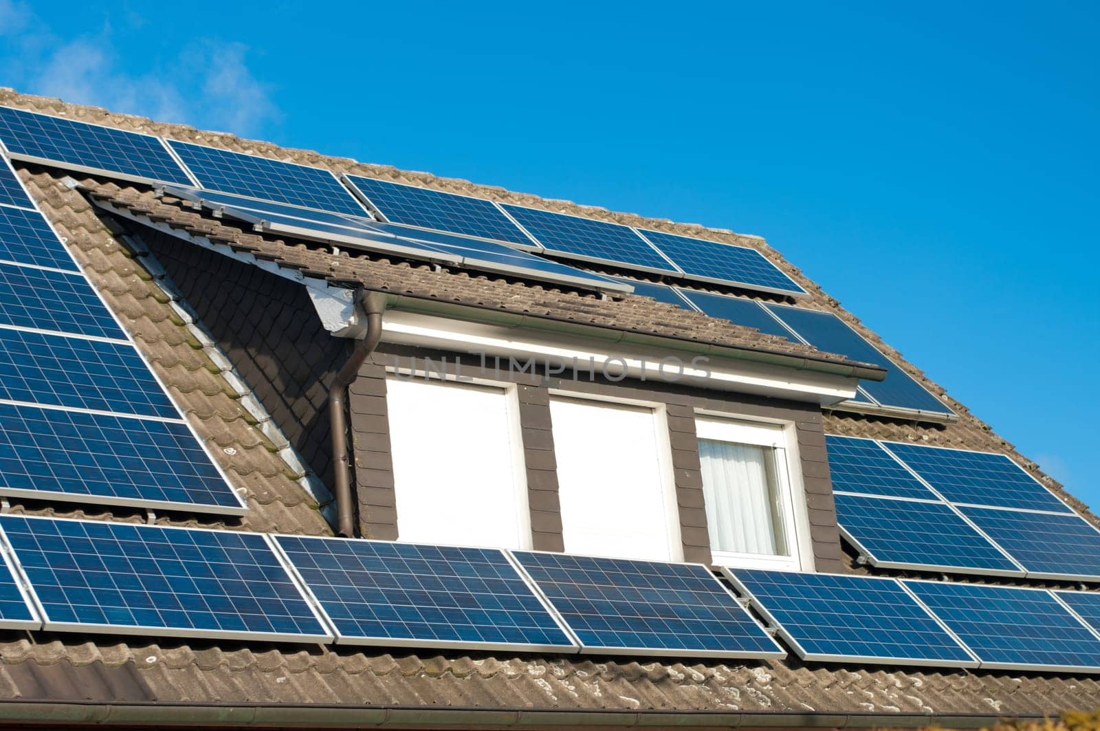 roof of a house covered with solar panels