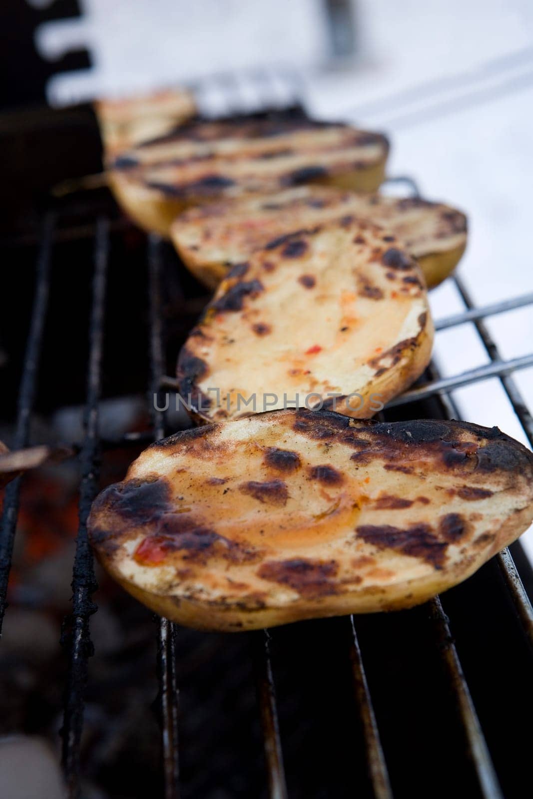 Close up of a Barbeque with potatoes