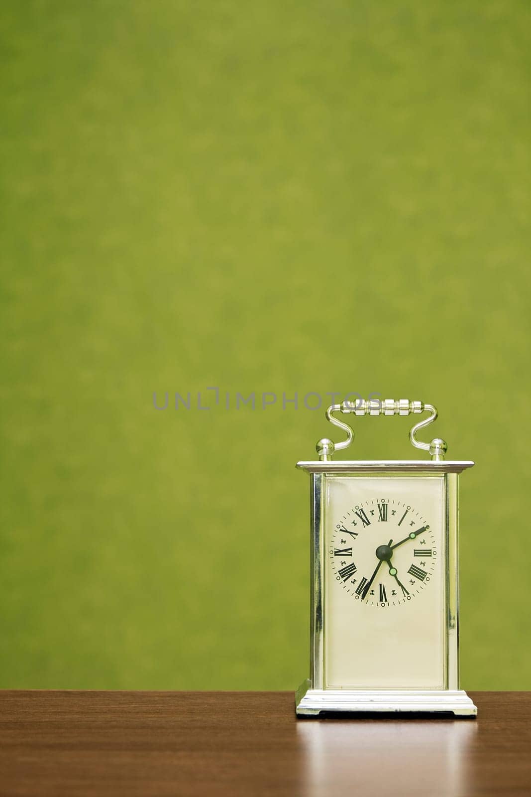 Old-fashioned clock shows the time ten past five