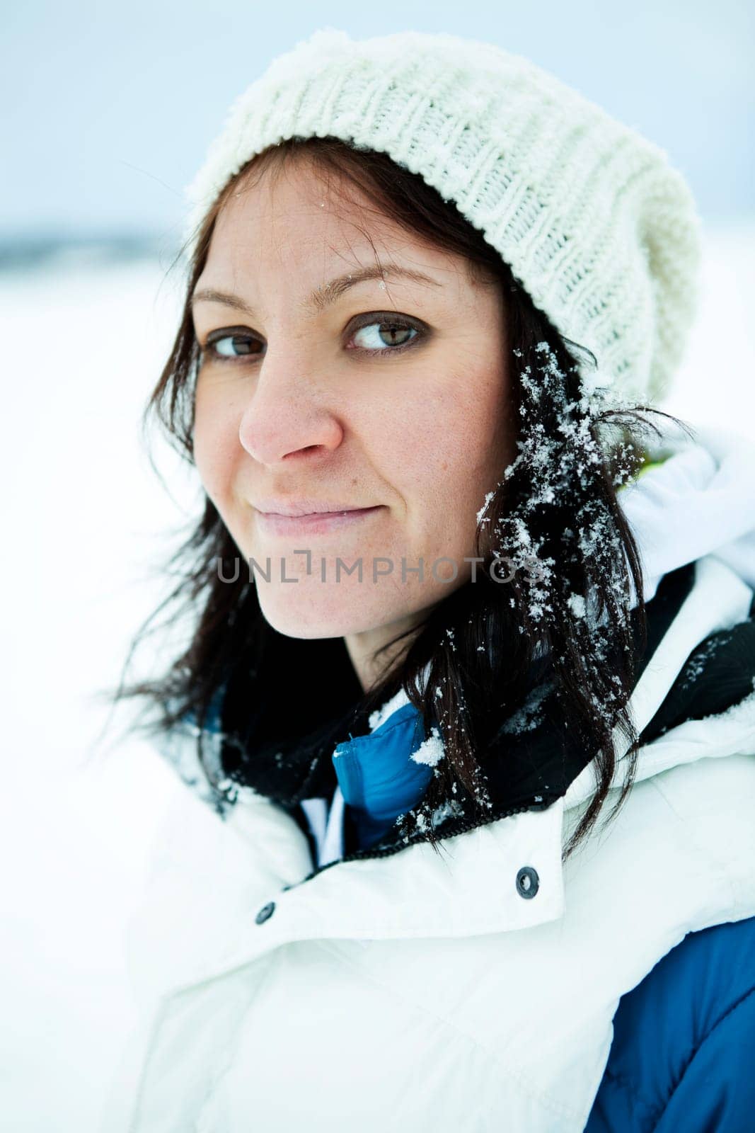 Portrait of a woman outdoors on a white winter day
