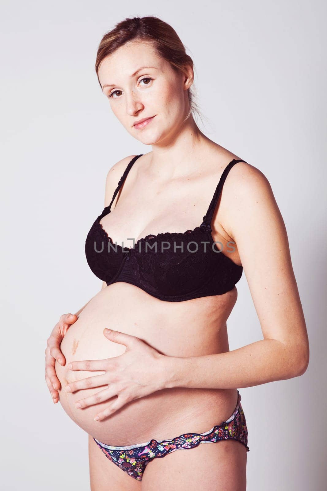 Portrait of a beautiful pregnant mother. Studio shot.