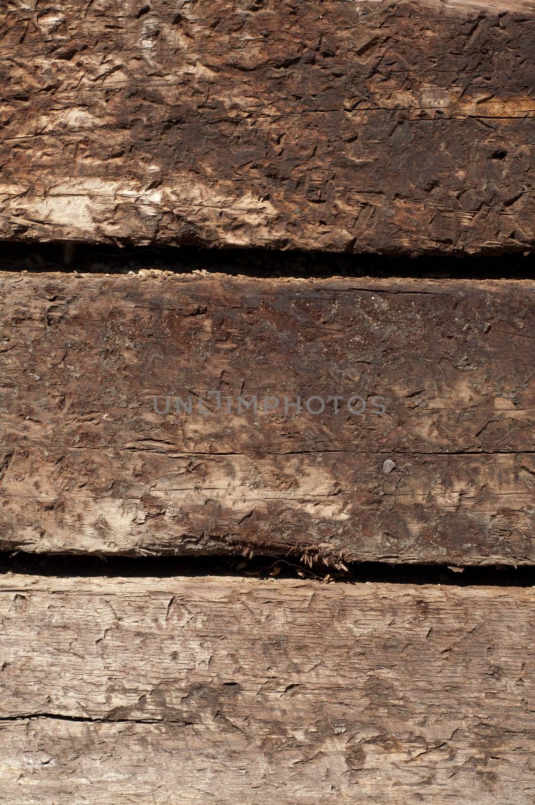 three stacked railroad ties in portrait position for texture or background