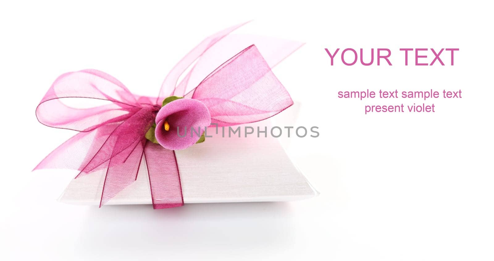 Small gift box decorated with ribbon and flower with copy space for your text