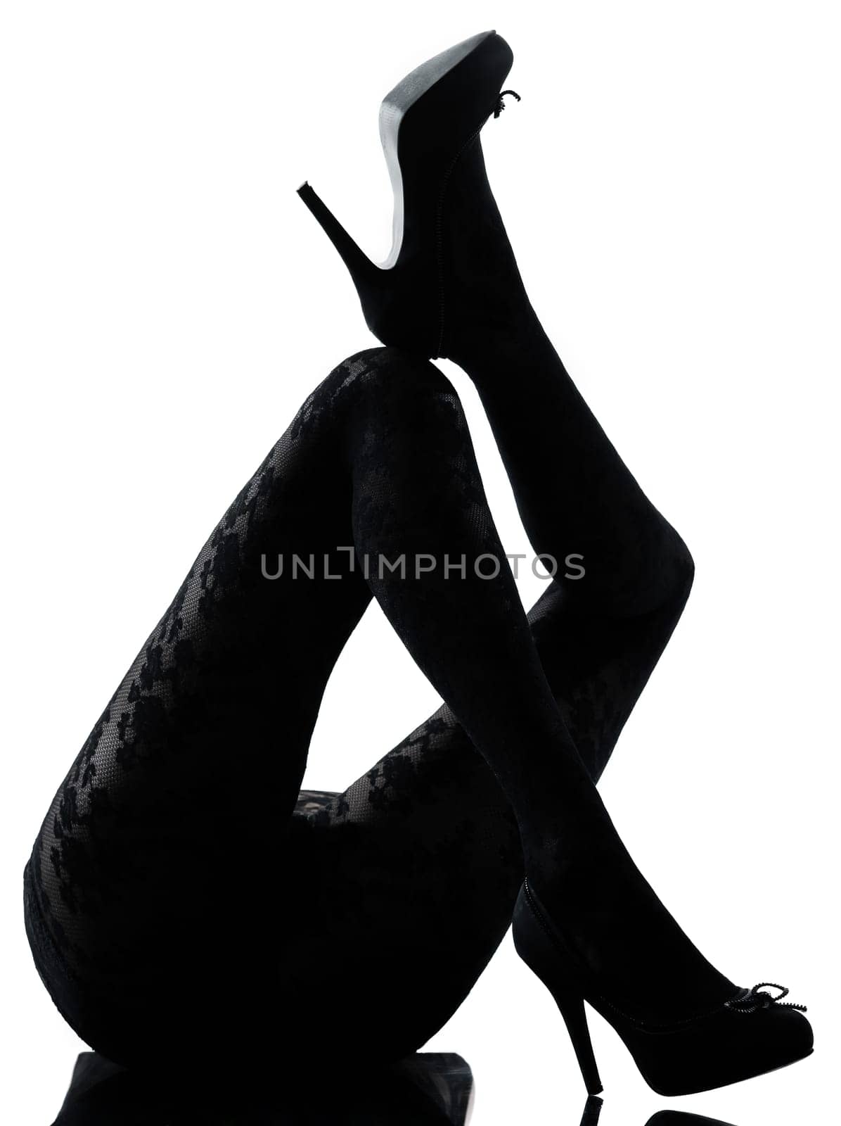 one woman legs silhouette on studio isolated white background