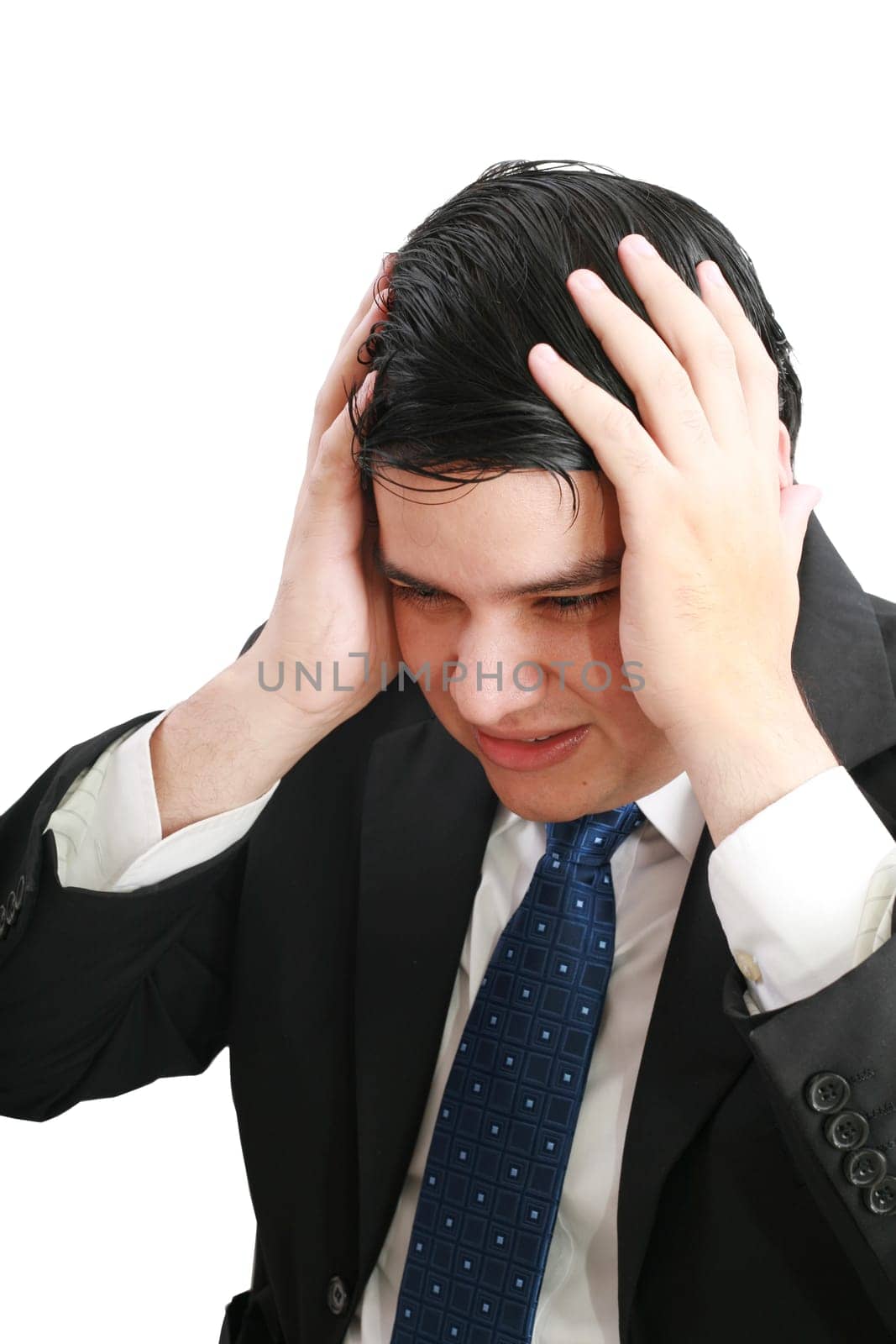 Man frustrated with hands on his head.