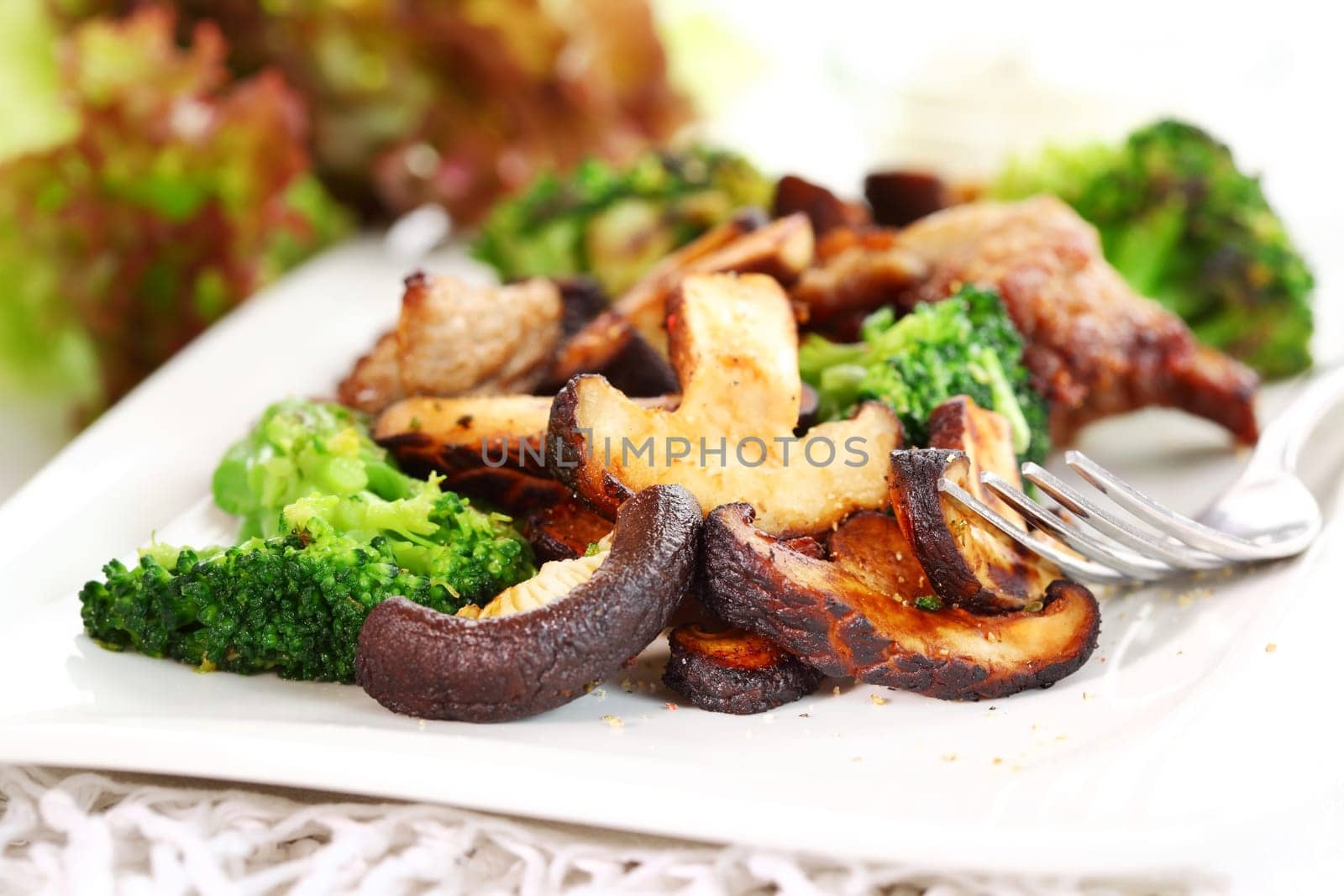 Roasted pork meat with shiitake mushrooms and broccoli