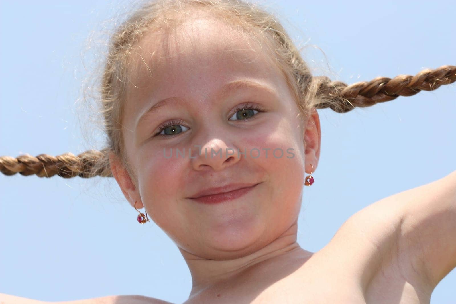 happy the child looks into the camera