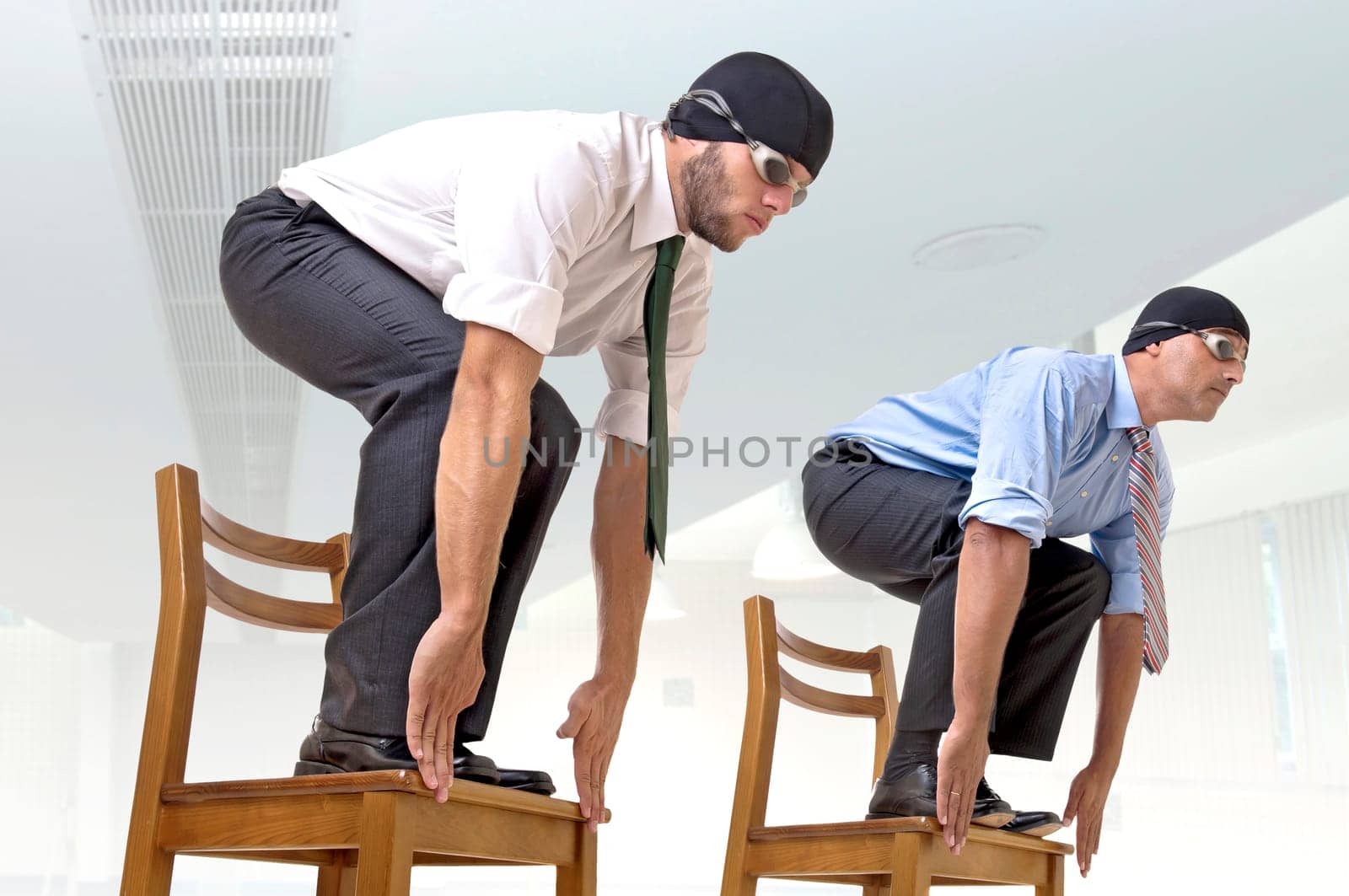 Businessmen with swimming gear ready to dive