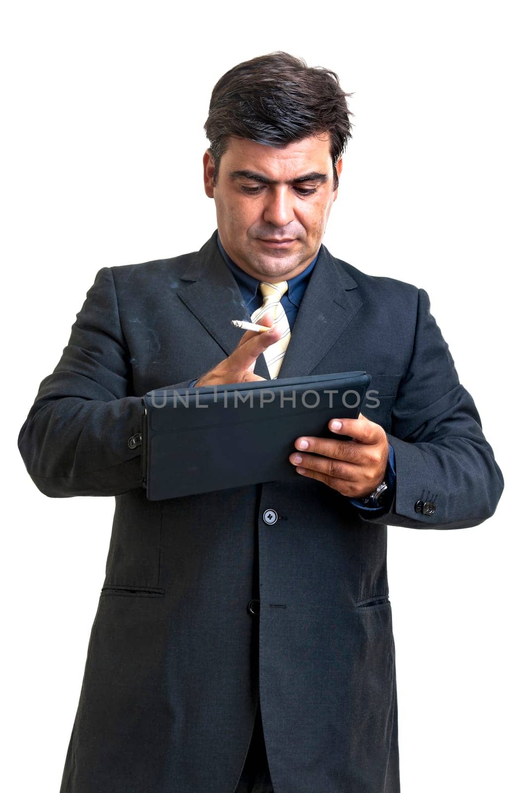 Smoking businessman with tablet isolated in white