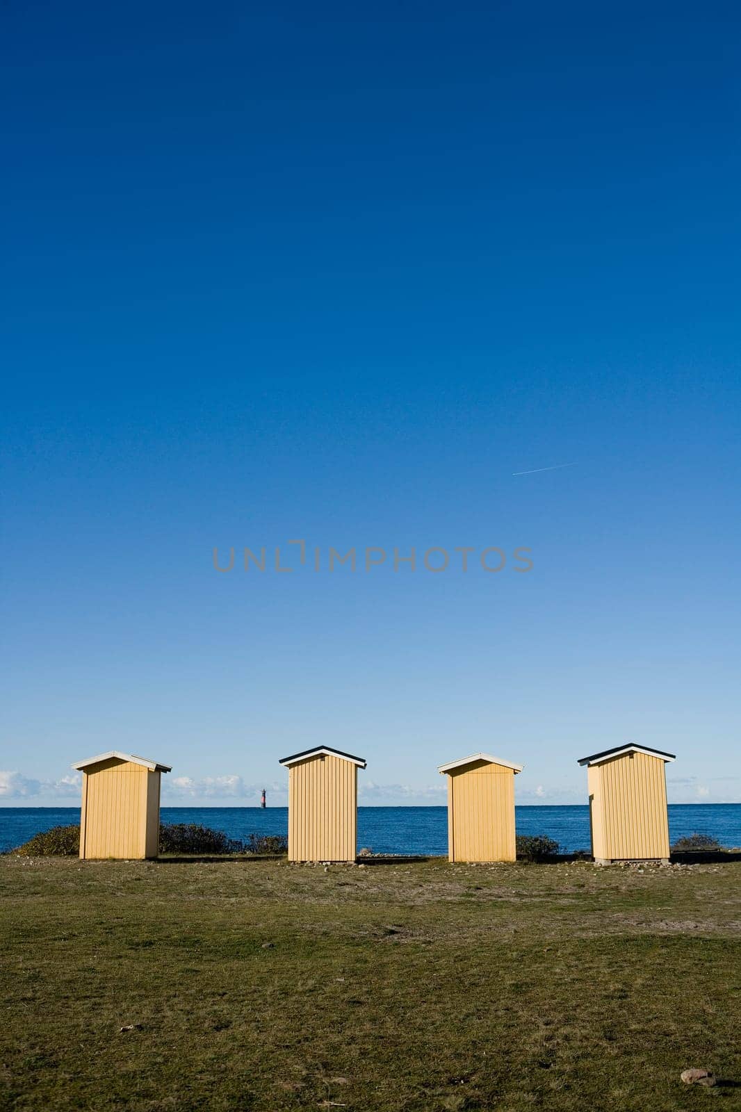 Row of boathouses on a sunny day