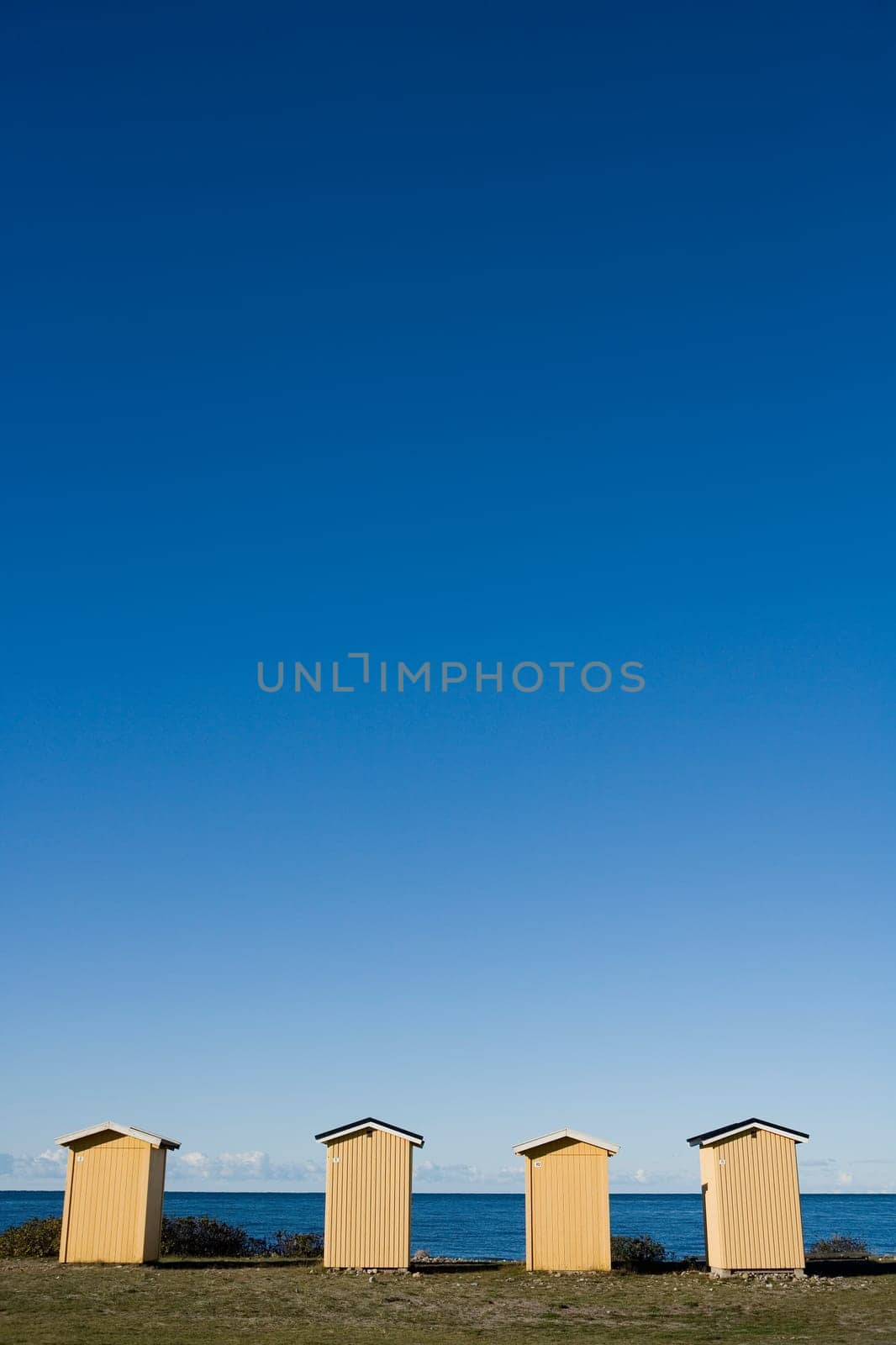 Row of boathouses on a sunny day