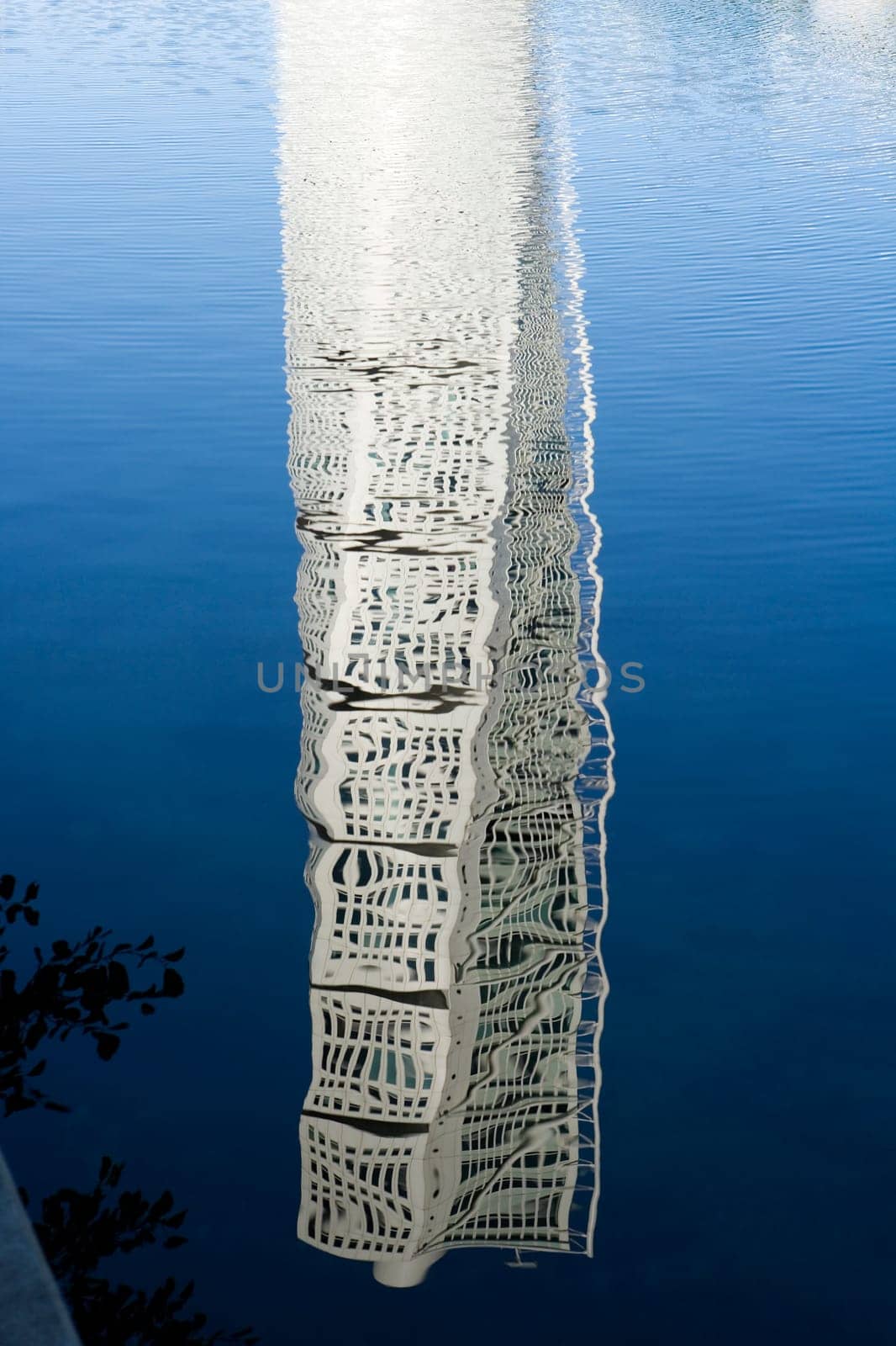 Skyscraper mirroring in the water