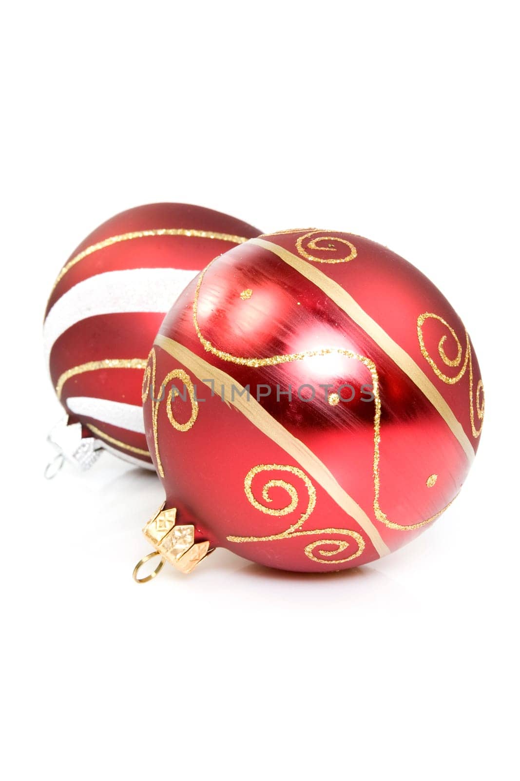 two red christmas balls over a white background.
