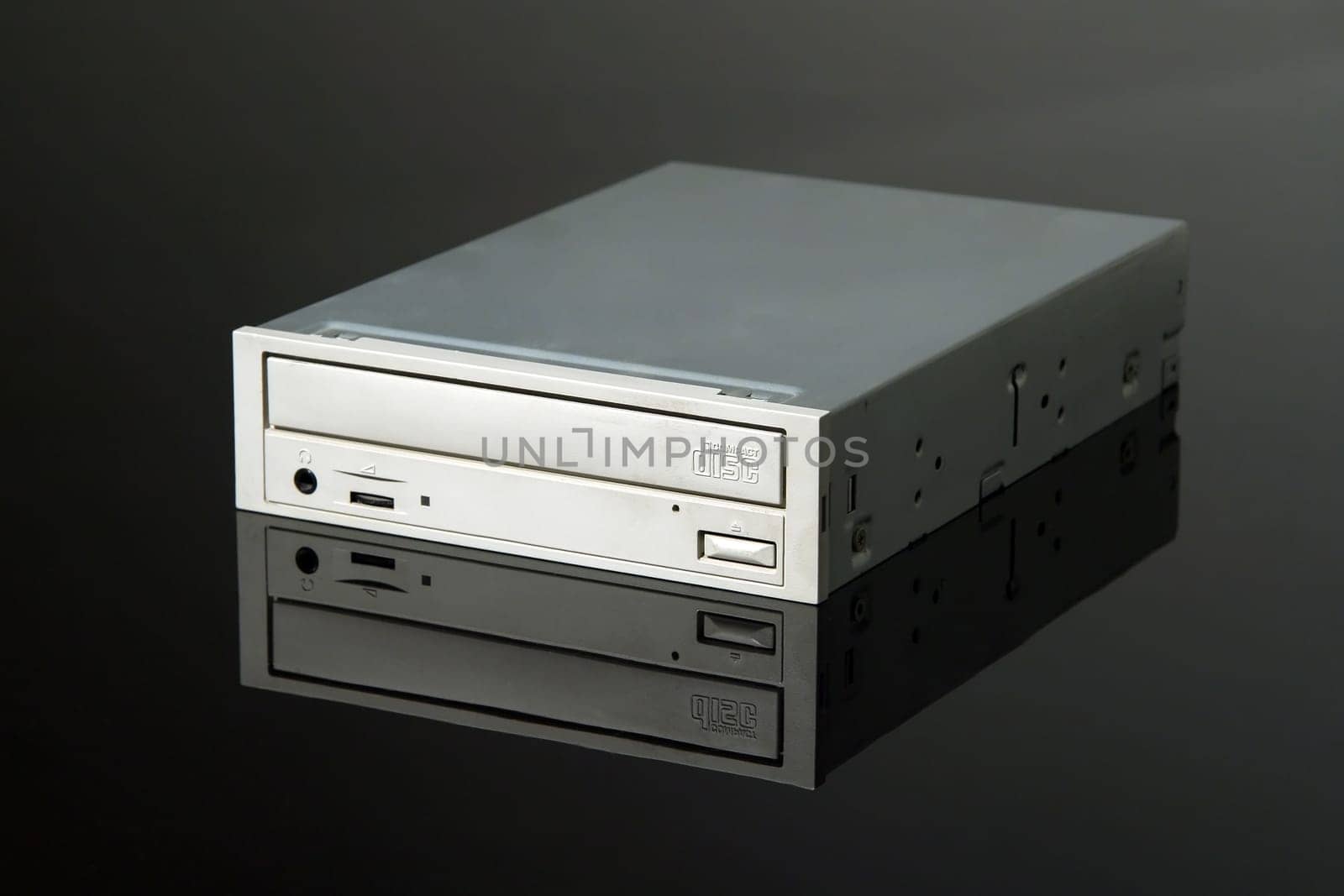internal CD-ROM drive on black reflective background
