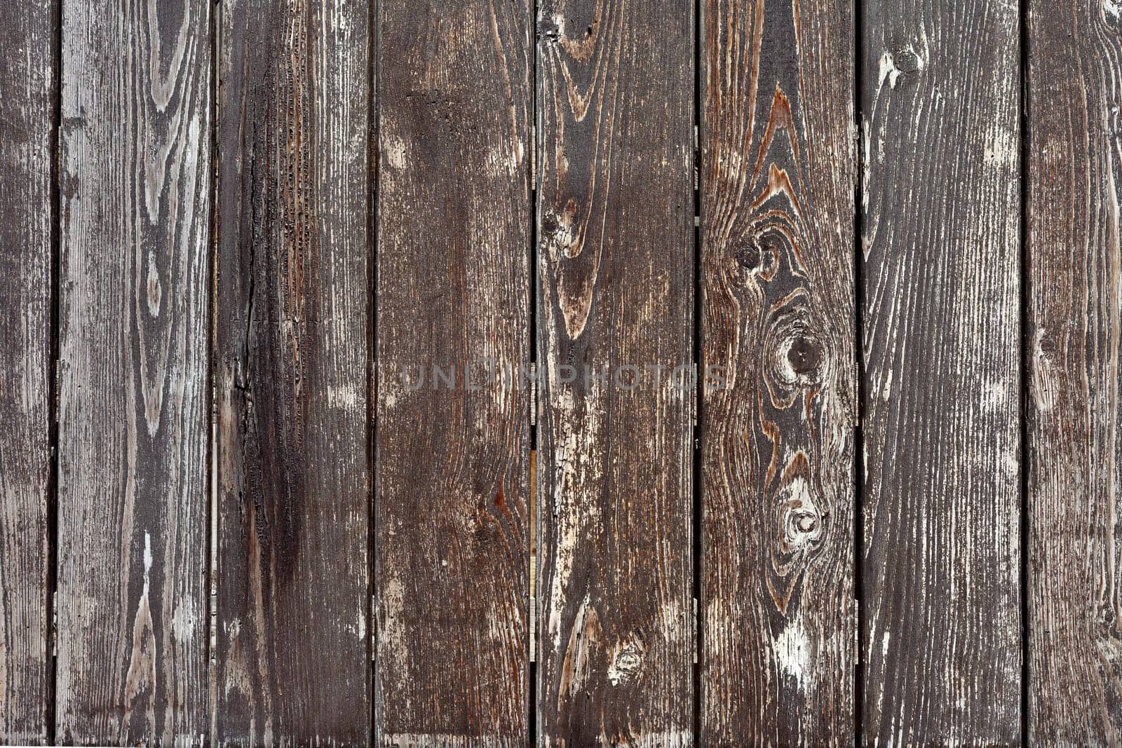 the dark wood texture with natural patterns