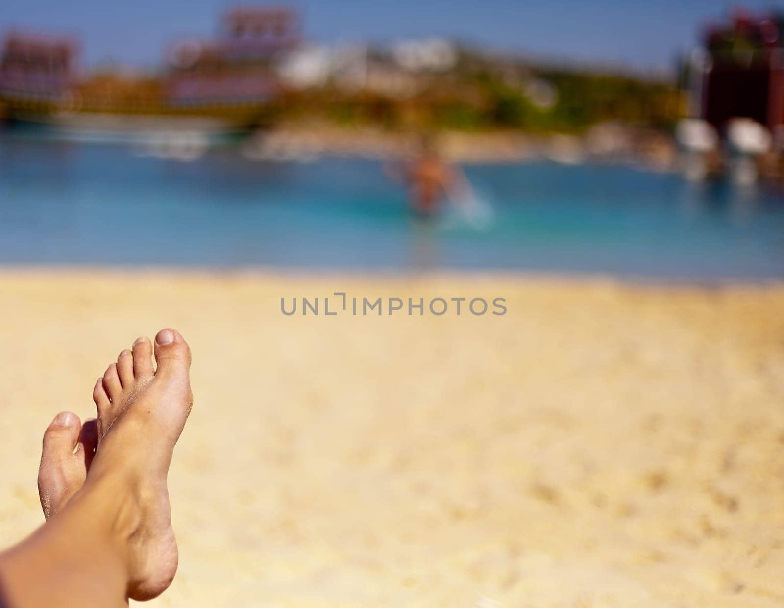 the sandy feet on the beautiful beach