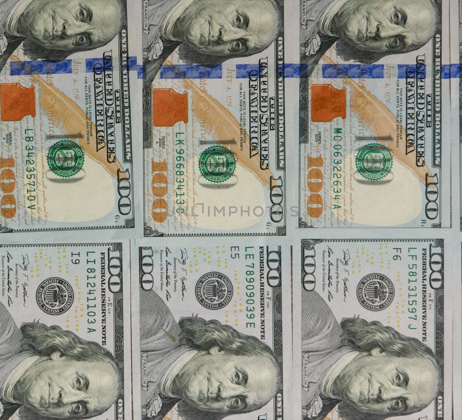 Background of six one hundred dollar bills close-up. by gelog67