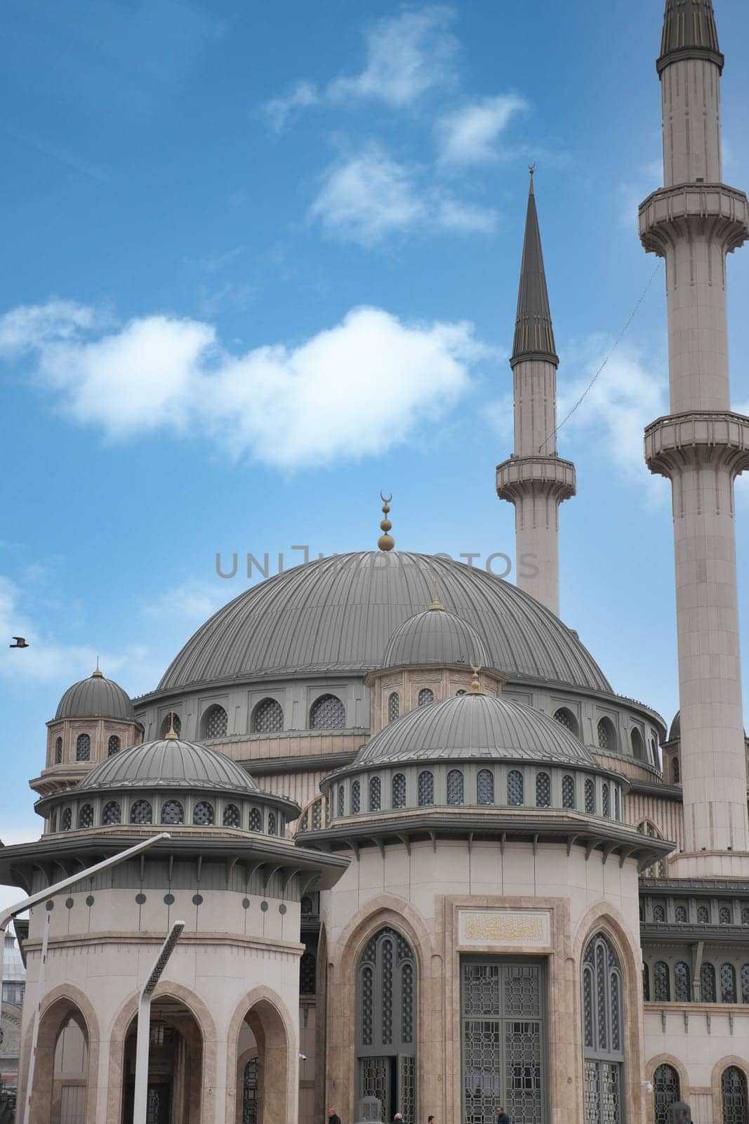the dome of a mosque against blue sky in istanbul .